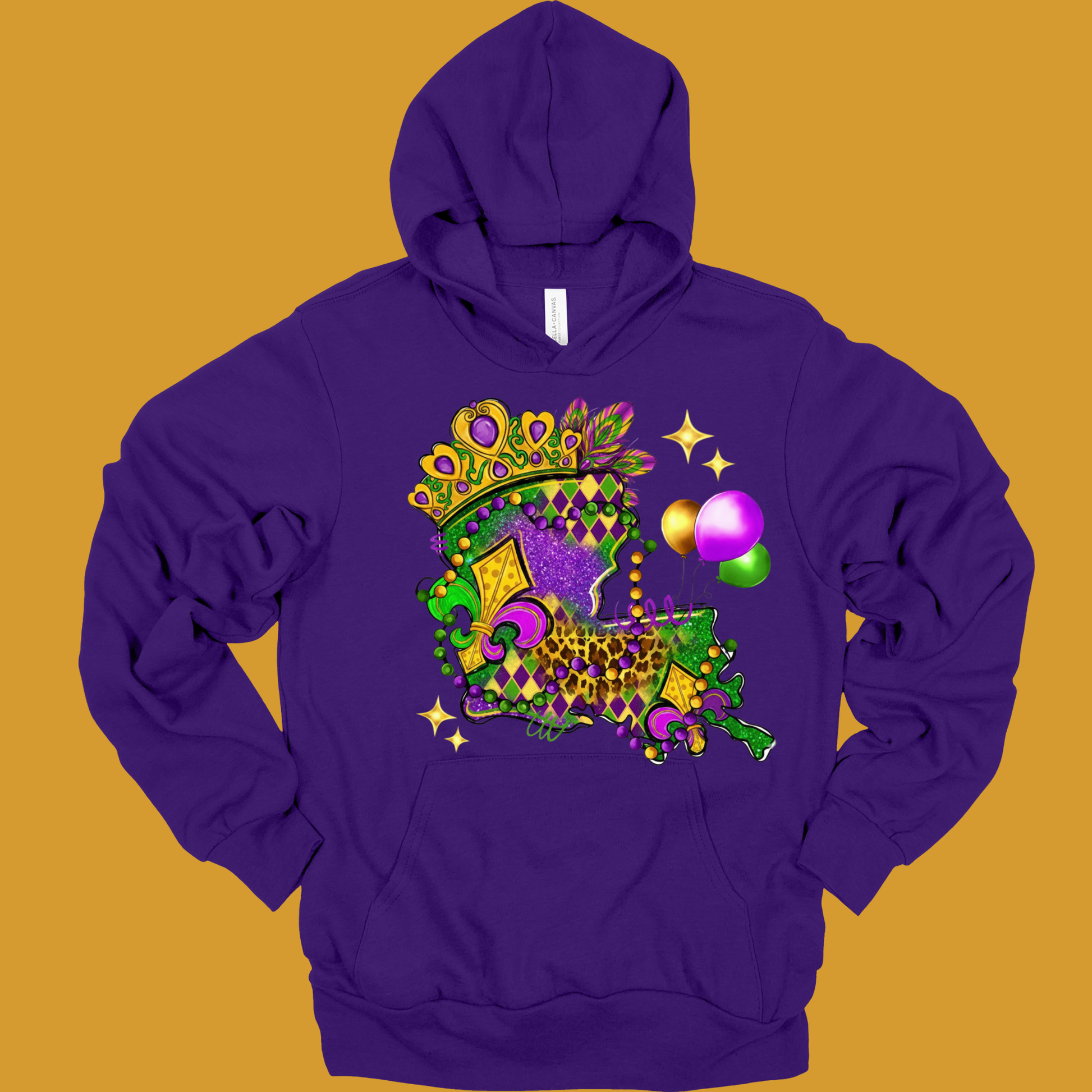 Purple hoodie with a colorful design on a mustard yellow background