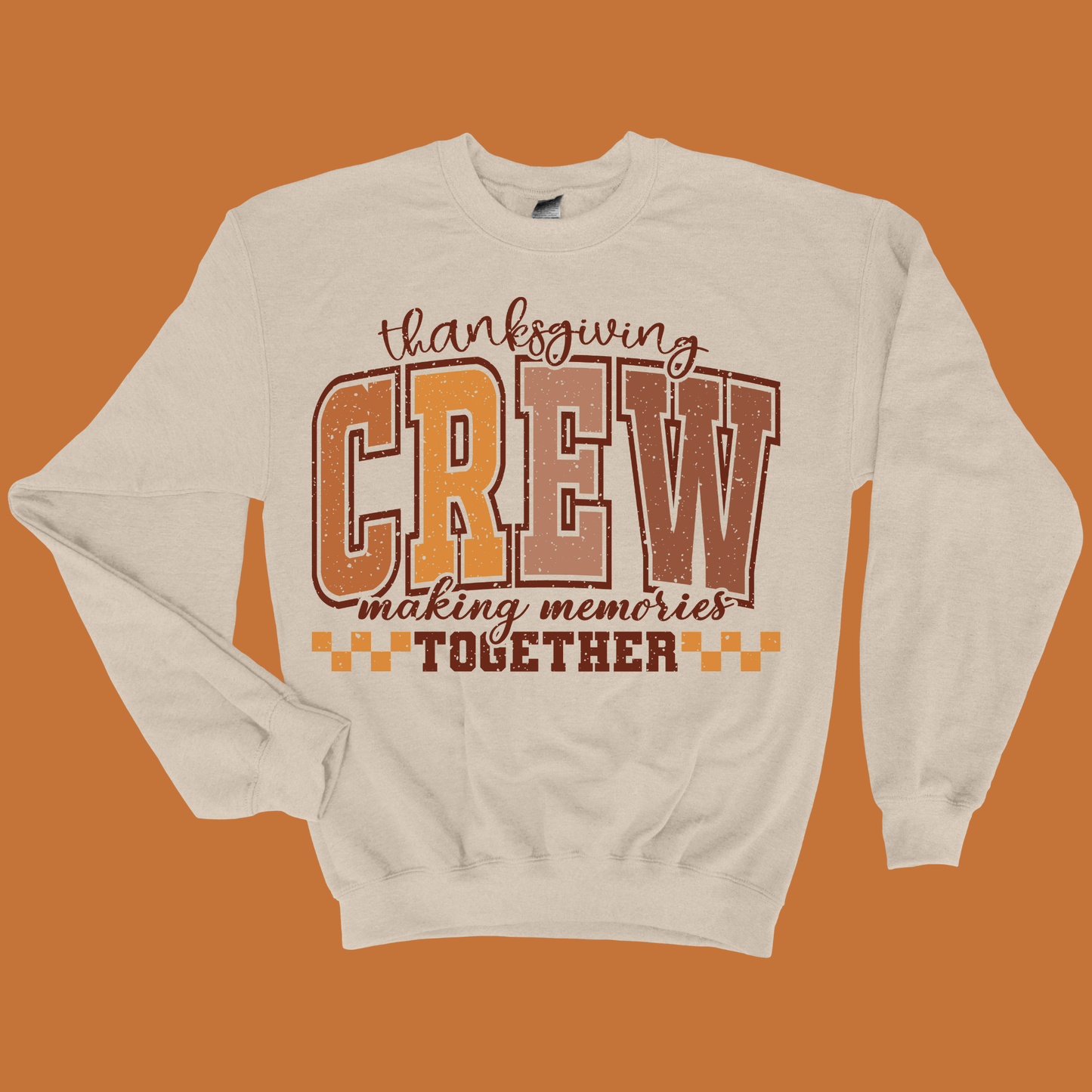Beige sweatshirt with 'Thanksgiving Crew making memories together' text on an orange background