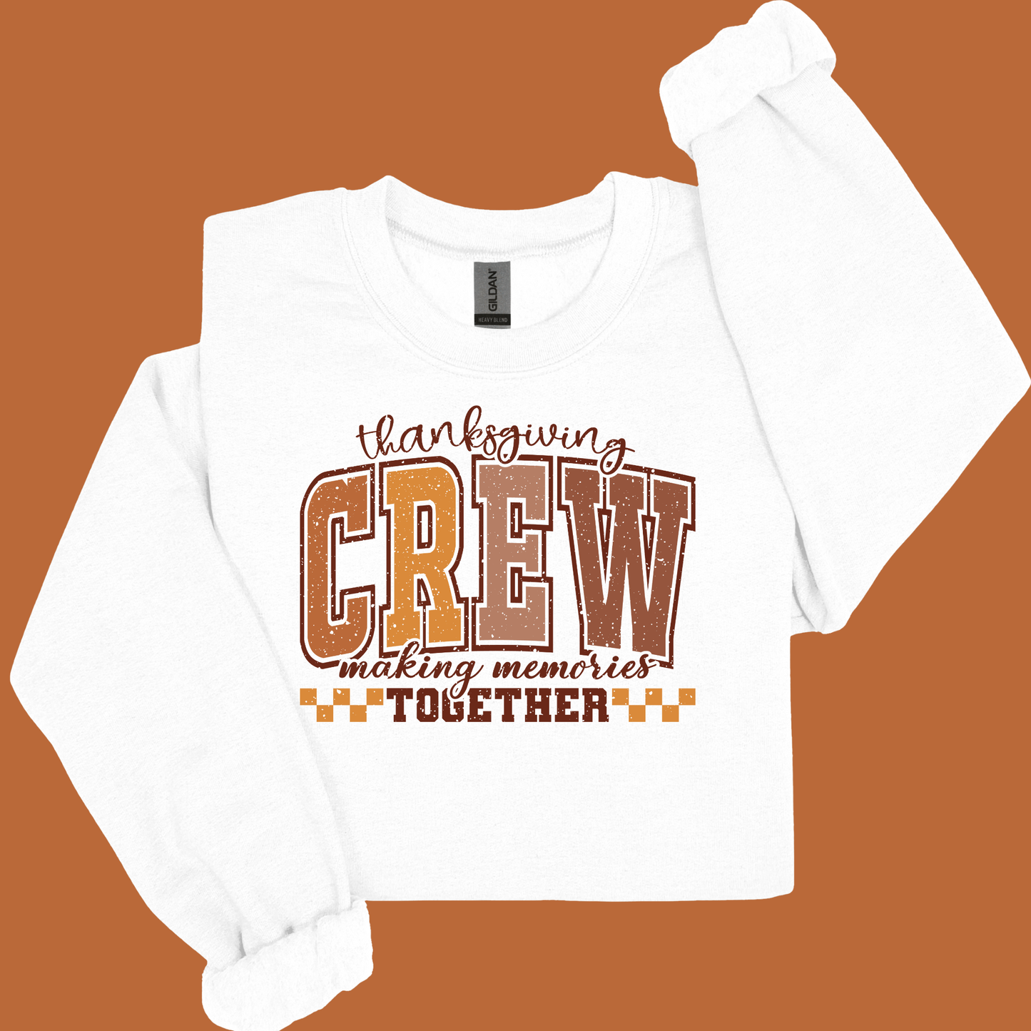 White long-sleeve shirt with 'Thanksgiving Crew making memories together' text on a brown background