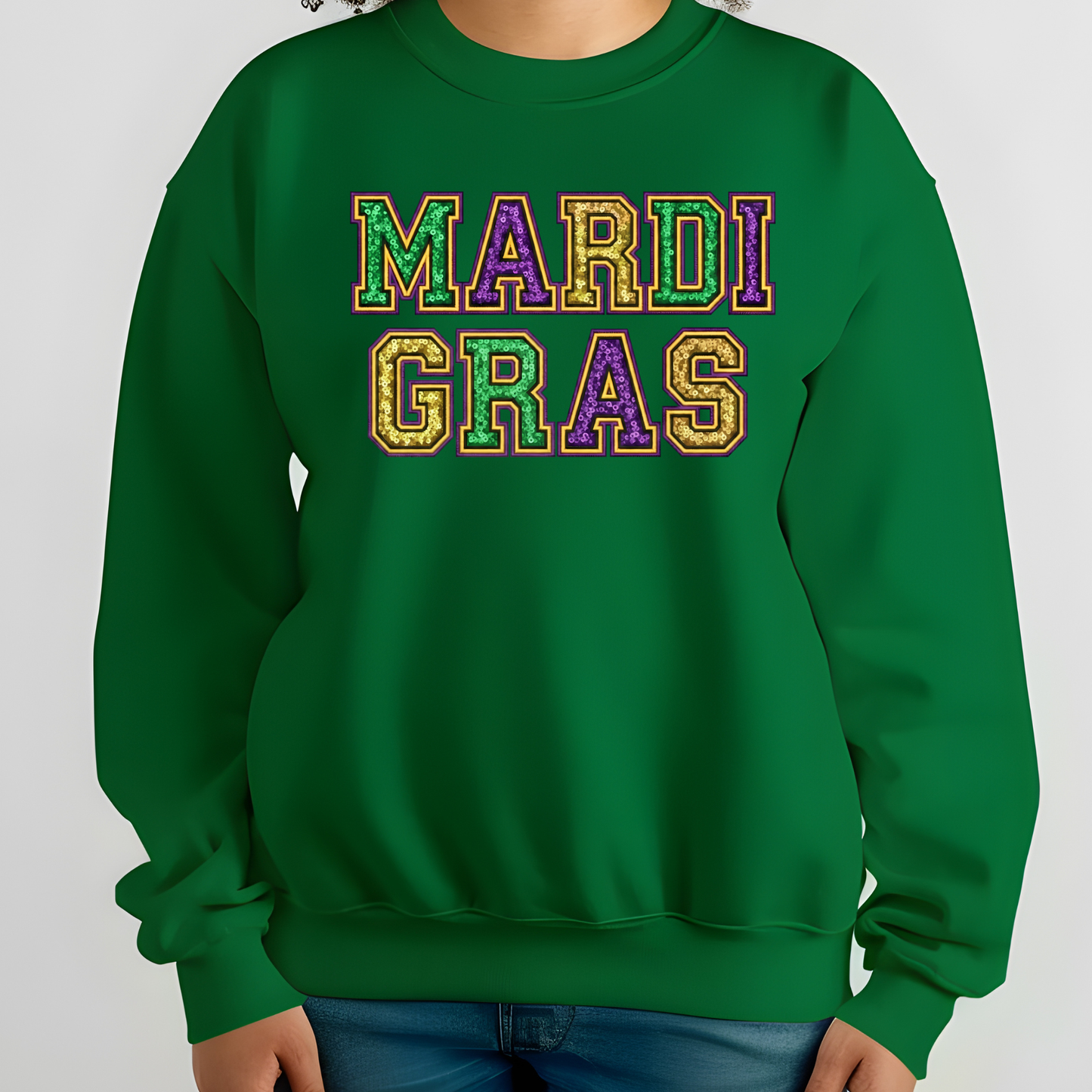 Green sweatshirt with 'MARDI GRAS' in colorful letters on a white background
