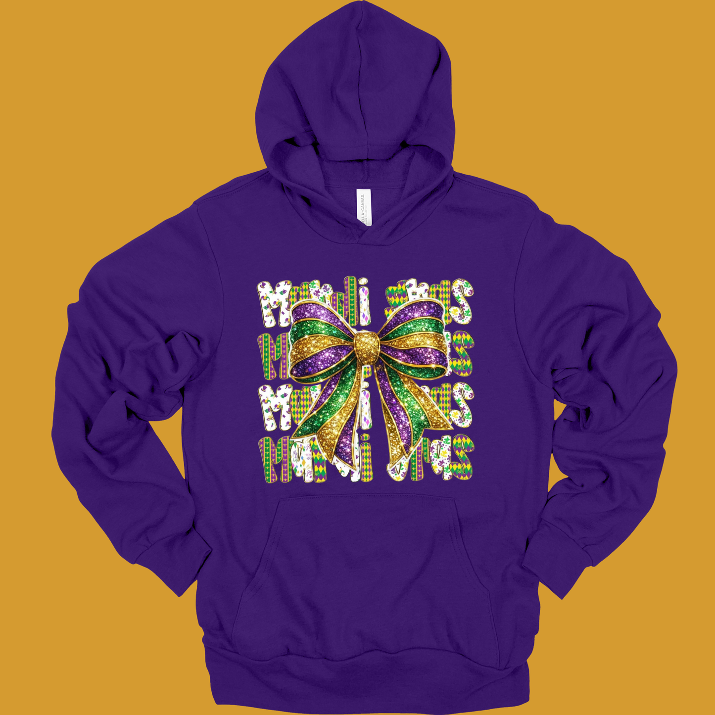 Purple hoodie with a colorful bow design on a mustard yellow background
