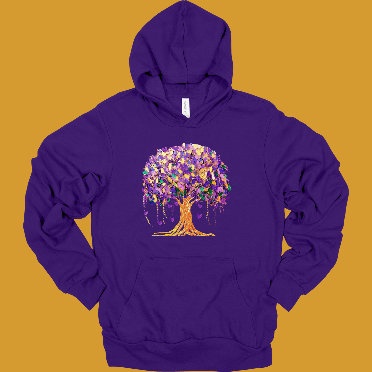 Purple hoodie with a colorful tree design on a mustard yellow background