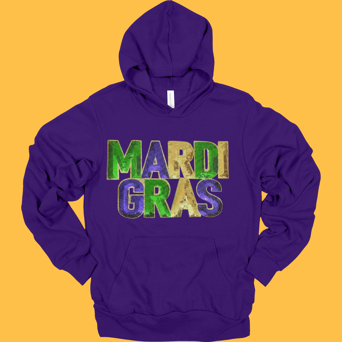 Purple hoodie with 'Mardi Gras' text on a yellow background