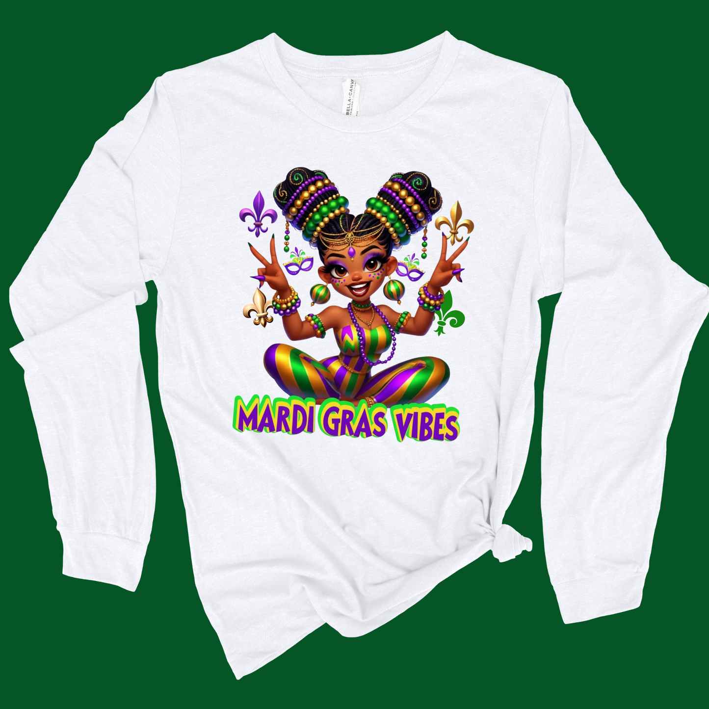White long-sleeve shirt with Mardi Gras-themed design featuring a cartoon character and 'Mardi Gras Vibes' text on a green background.