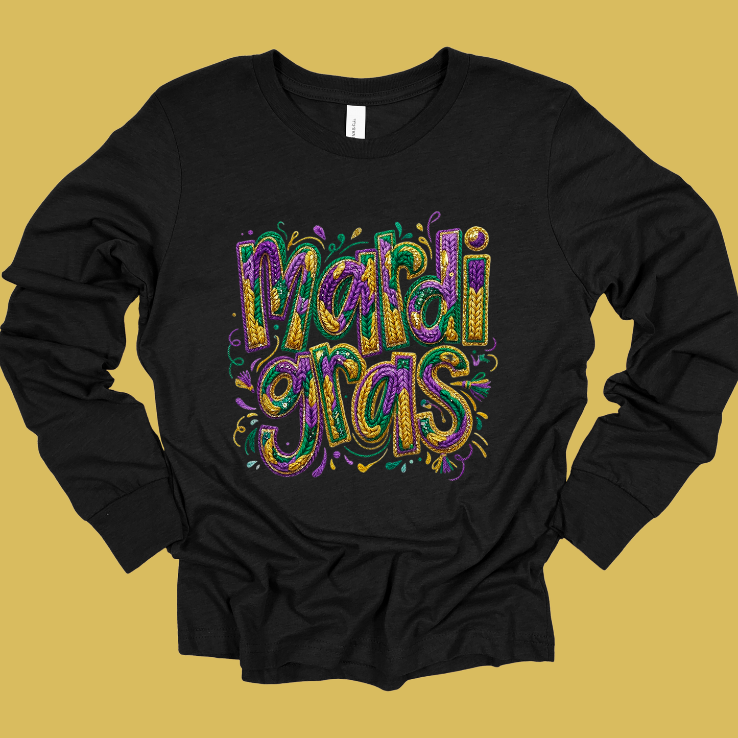 Black long-sleeve shirt with colorful 'Mardi Gras' text on a yellow background