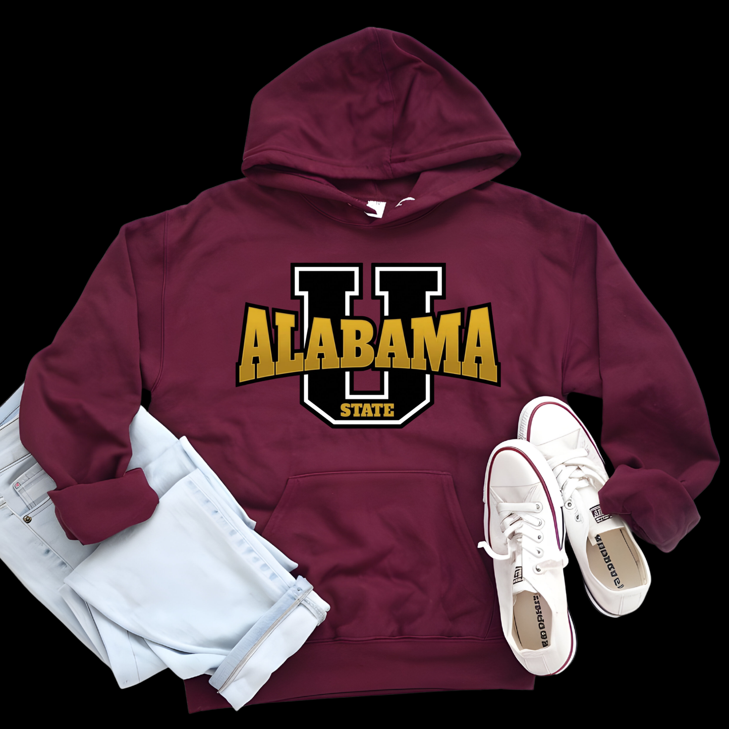 A maroon pullover hoodie with a large yellow and black hornet graphic and the words 'Hornets Nation' on the front, styled in a flat lay with light blue jeans and white sneakers on a black background.