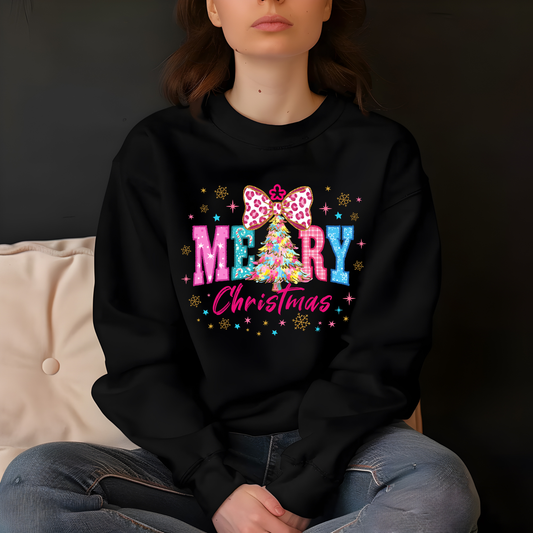 Person wearing a black sweatshirt with a colorful 'Merry Christmas' design.