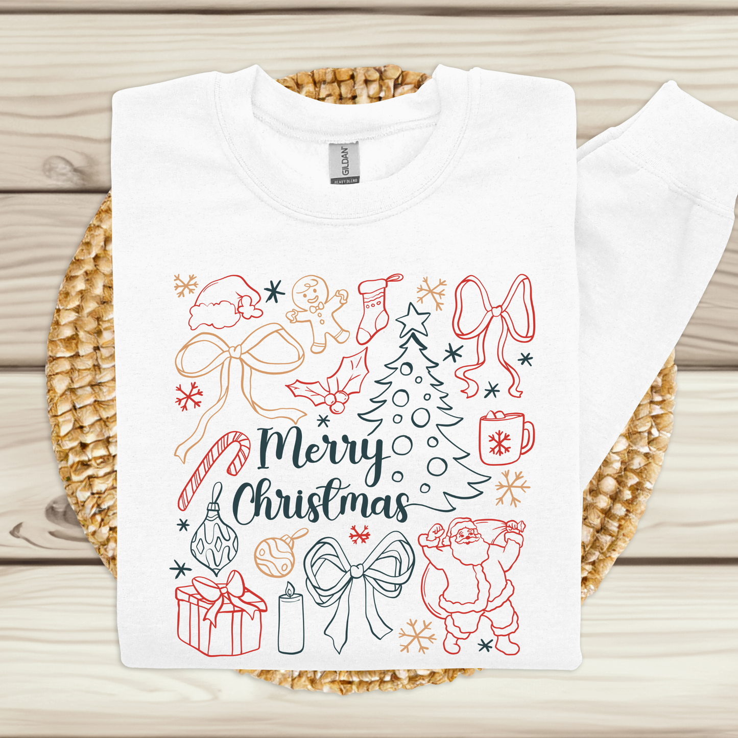 White t-shirt with Christmas-themed graphics on a woven mat