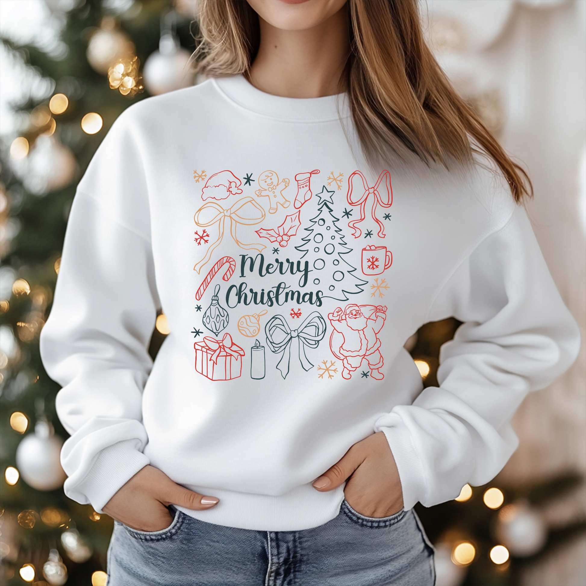 Person wearing a white sweatshirt with Christmas-themed design in front of a decorated Christmas tree.