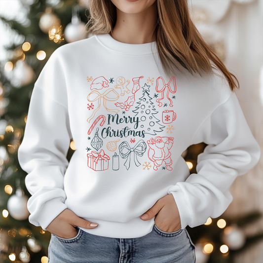 Person wearing a white sweatshirt with Christmas-themed design in front of a decorated Christmas tree.