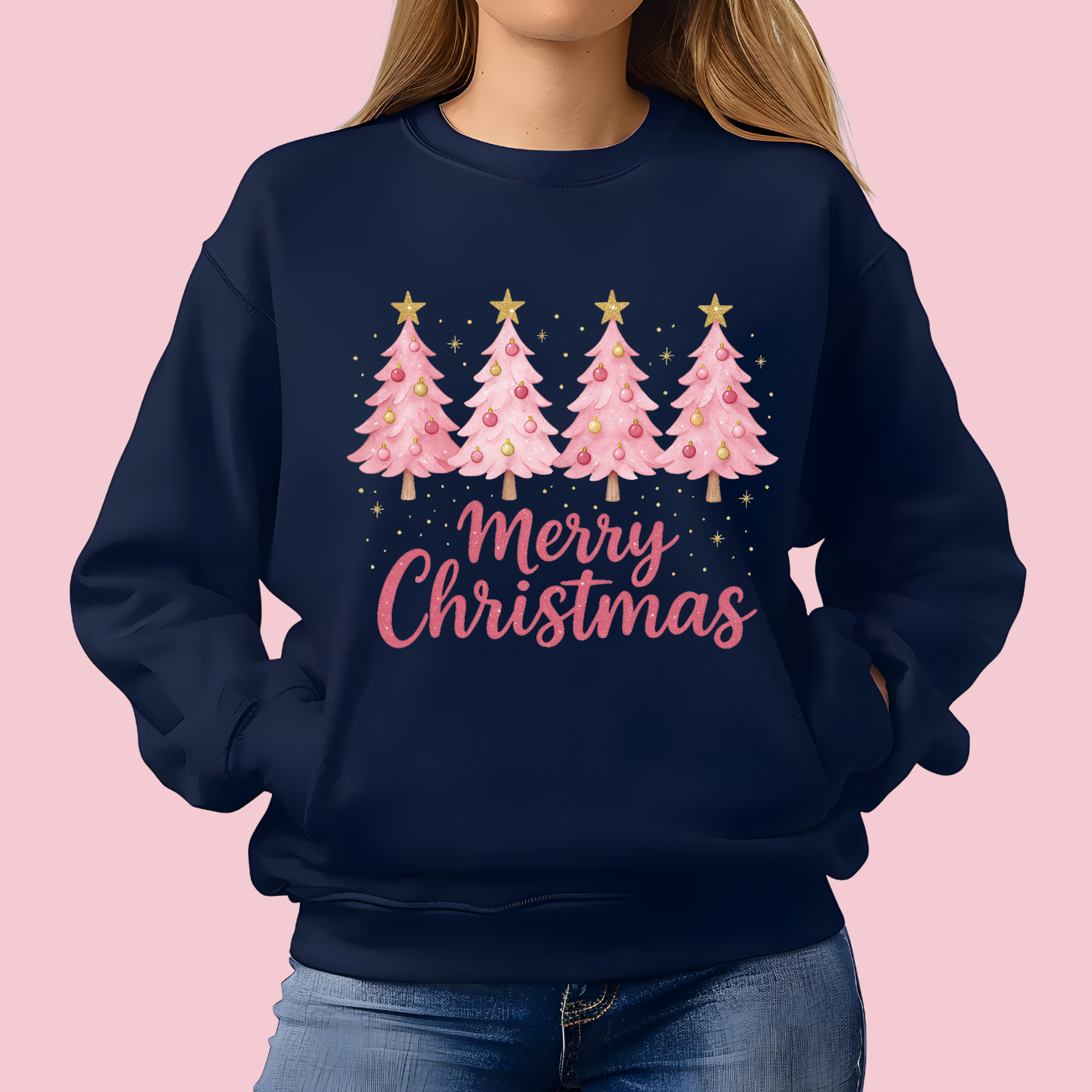 Navy blue sweatshirt with pink Christmas tree design and 'Merry Christmas' text on a pink background