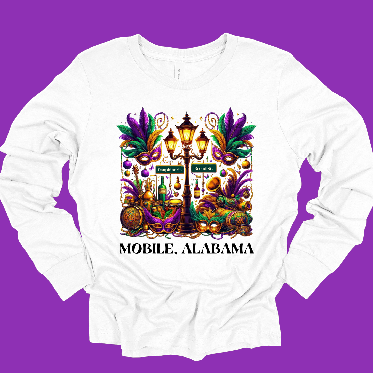 White long-sleeve shirt with Mardi Gras-themed design and 'Mobile, Alabama' text on a purple background