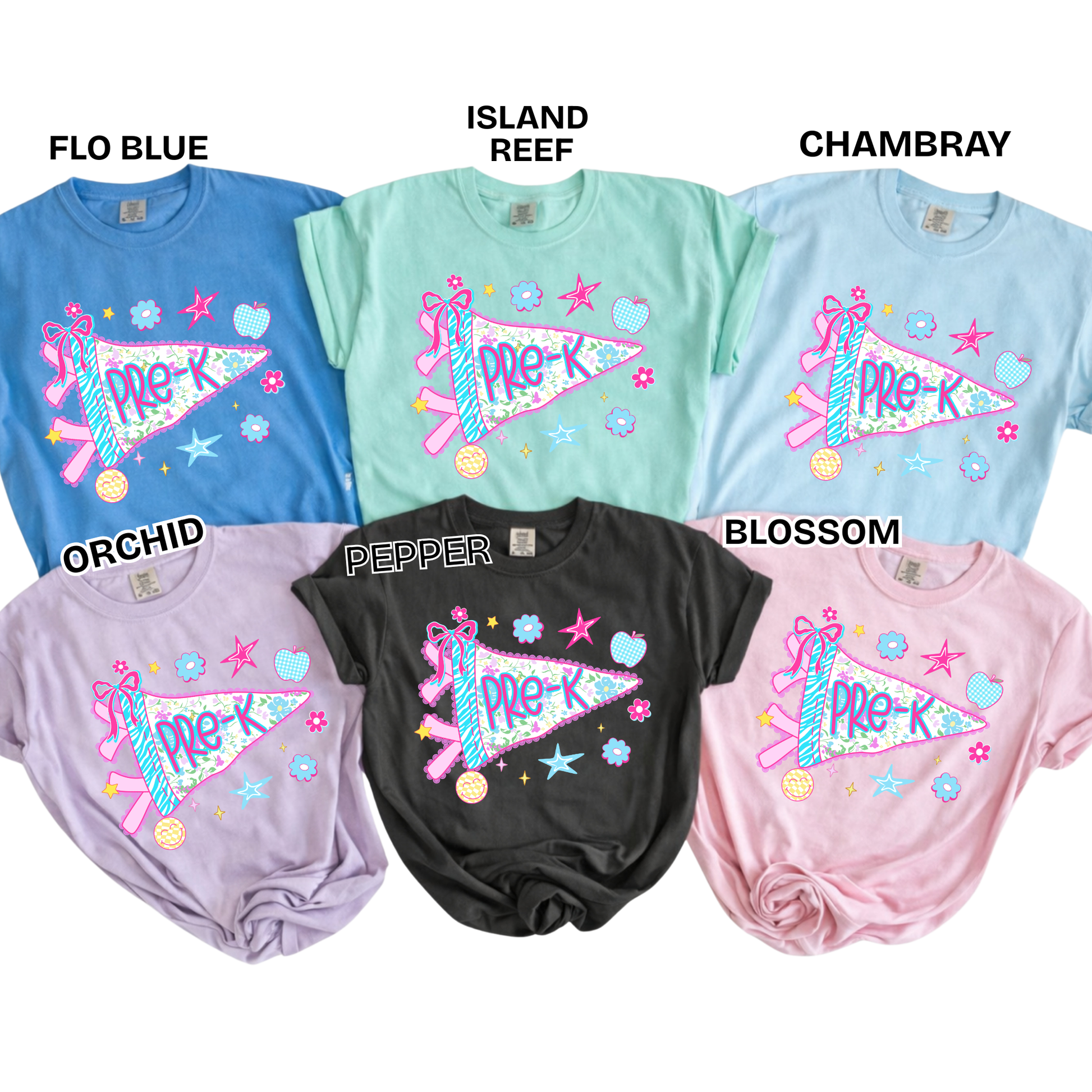 Six women's short-sleeve graphic T-shirts arranged in a 2x3 grid on a white background, each labeled with a color name: Flo Blue, Island Reef, Chambray, Orchid, Pepper, and Blossom. Each shirt has a large multicolor pennant graphic with the text 'PRE-K' and decorative stars, hearts, and stripes.