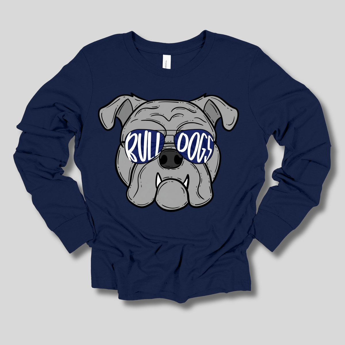 A navy blue long-sleeve t-shirt with a cartoon graphic of a bulldog wearing blue sunglasses with the text 'RULL DOGS' in white, displayed on a neutral gray background.