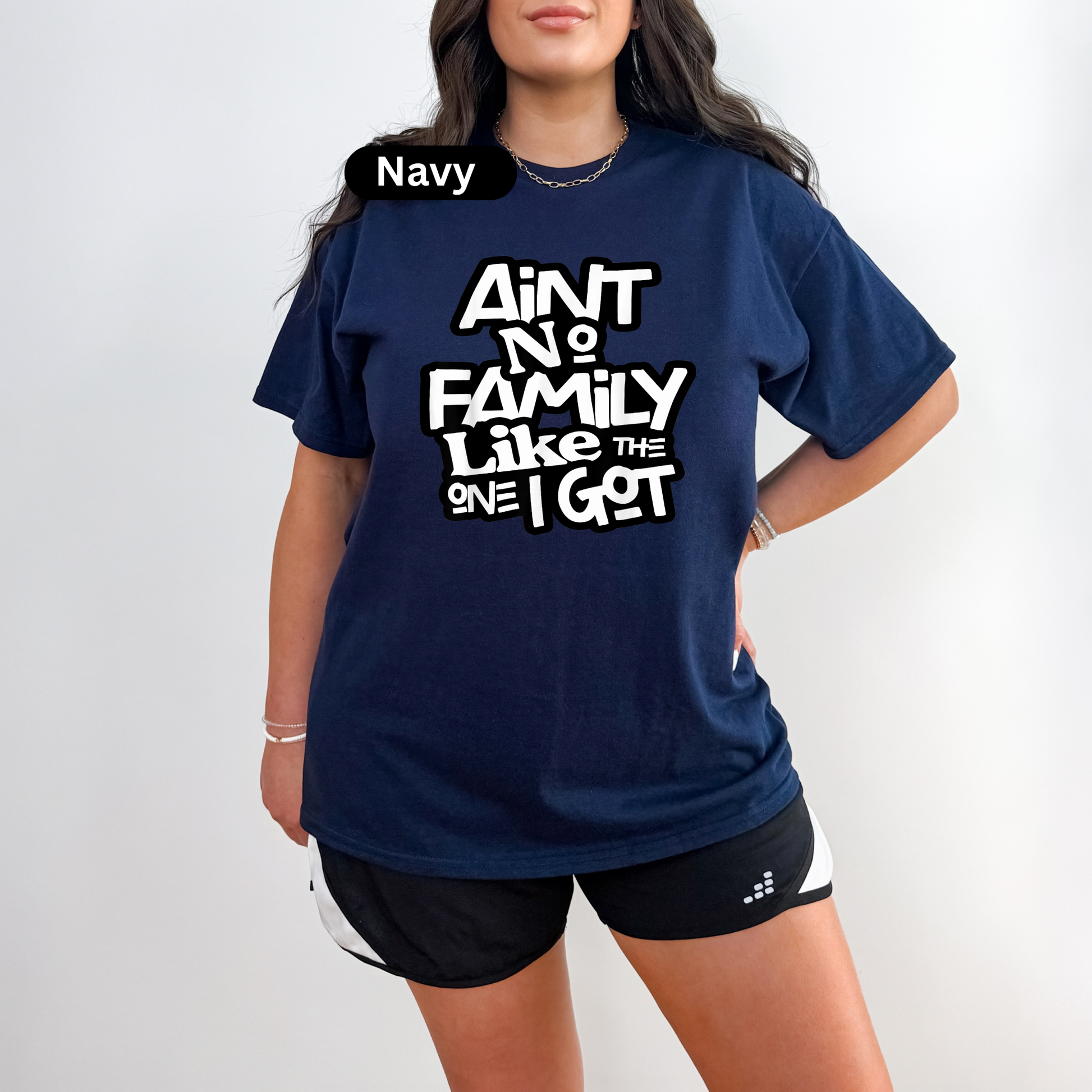 Person wearing a navy blue t-shirt with text on a white background