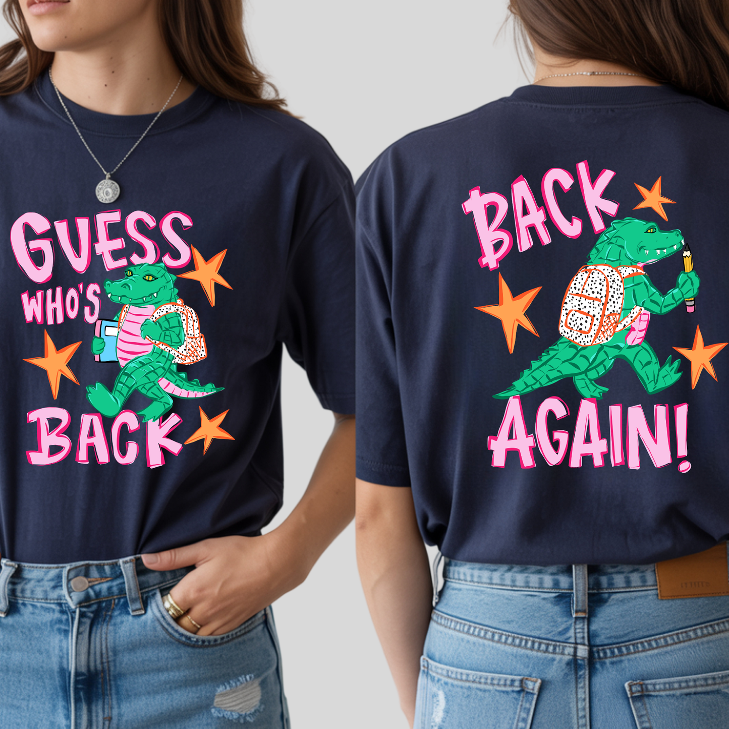 A navy blue graphic t-shirt shown on a model from both the front and back. The front features a green alligator wearing a pink striped shirt and carrying a patterned backpack, with the text 'GUESS WHO'S BACK' in pink and orange.