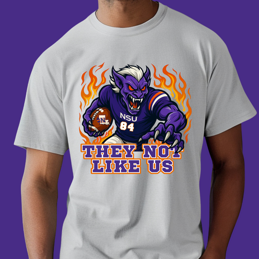 T-shirt with a graphic design of a creature holding a football and text on a purple background  Northwestern Demons Game Day T-Shirt - Demons  "They Not Like Us"  Football Tee