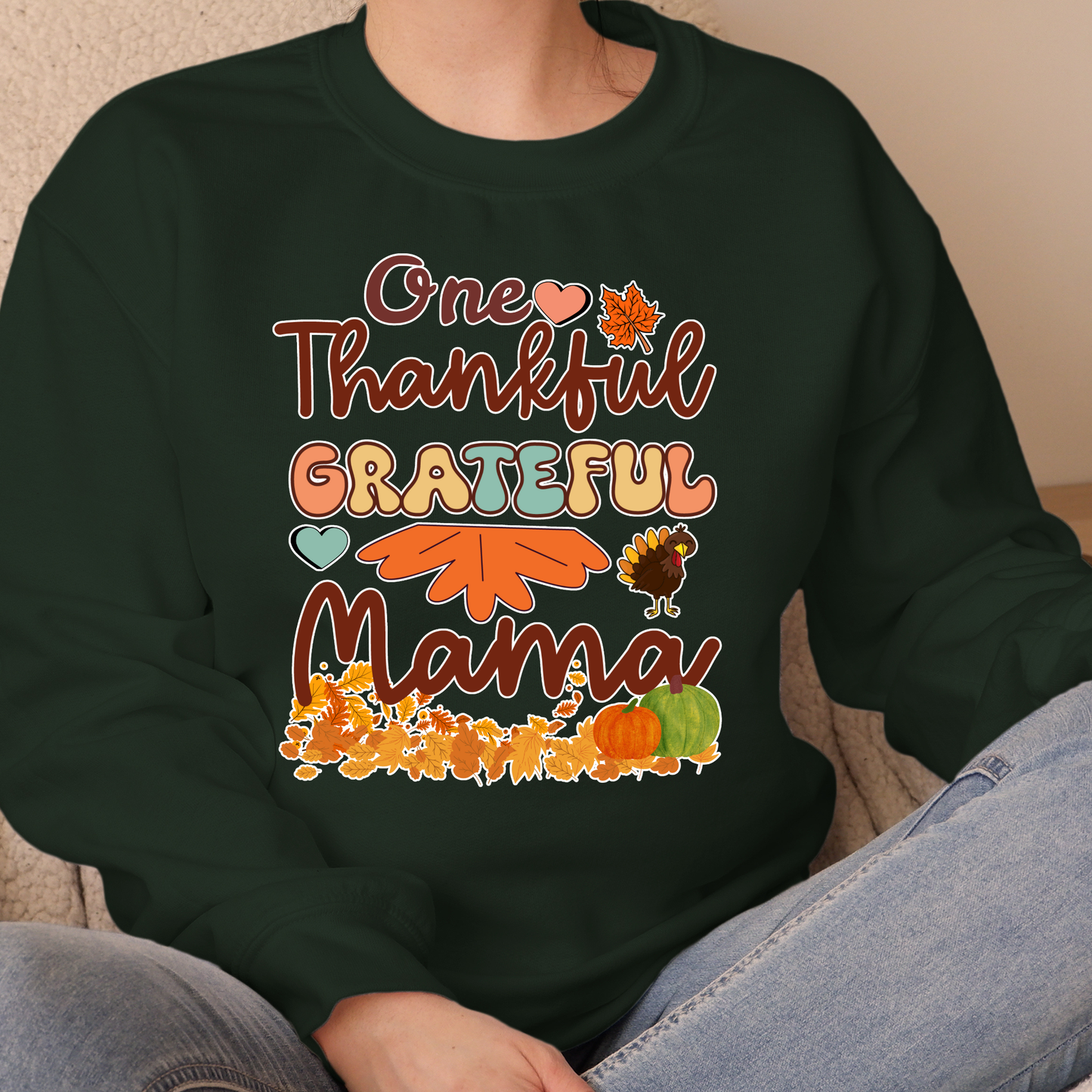 Black sweatshirt with 'One Thankful Grateful Mama' text and fall-themed graphics.  Retro Thanksgiving Sweatshirt "One Thankful Mama" Cozy Fall Mom Crewneck