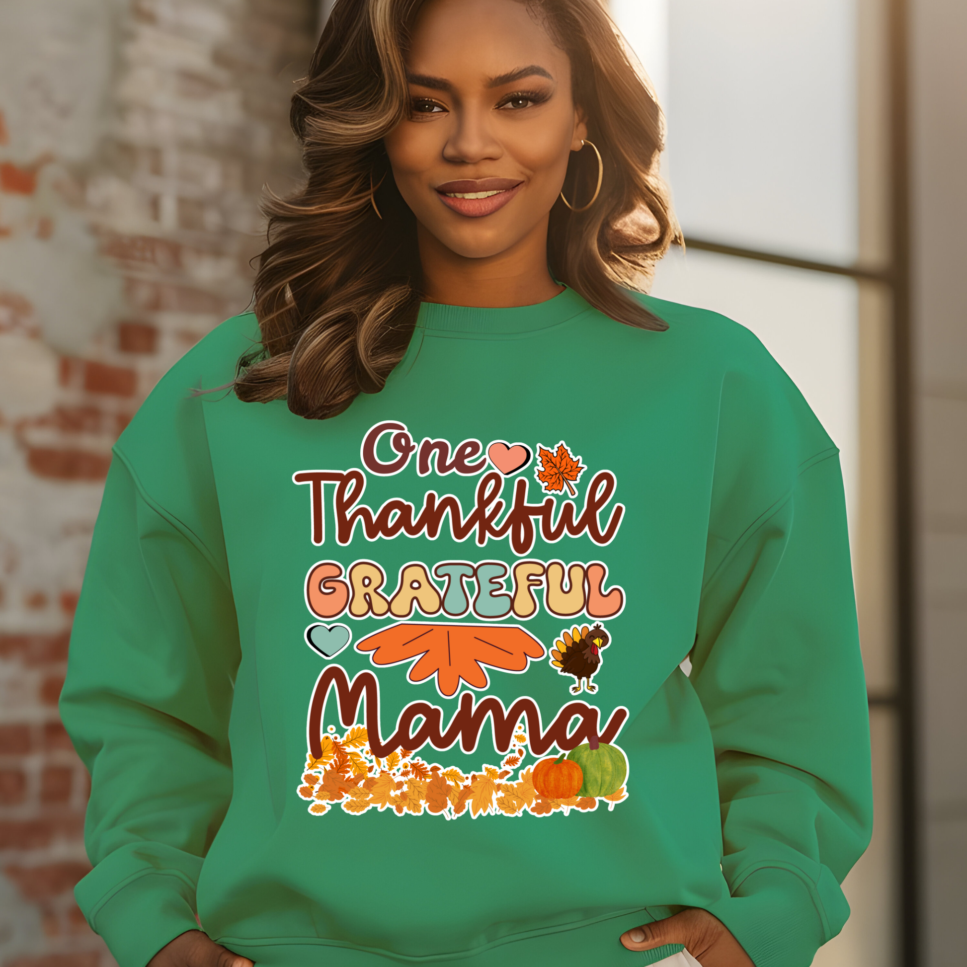 Woman wearing a green sweatshirt with 'One Thankful Grateful Mama' text and fall-themed graphics.  Retro Thanksgiving Sweatshirt "One Thankful Mama" Cozy Fall Mom Crewneck