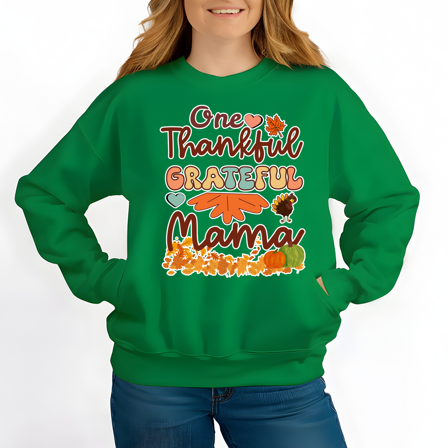 Green sweatshirt with 'One Thankful Grateful Mama' text and fall-themed graphics worn by a person. Retro Thanksgiving Sweatshirt "One Thankful Mama" Cozy Fall Mom Crewneck
