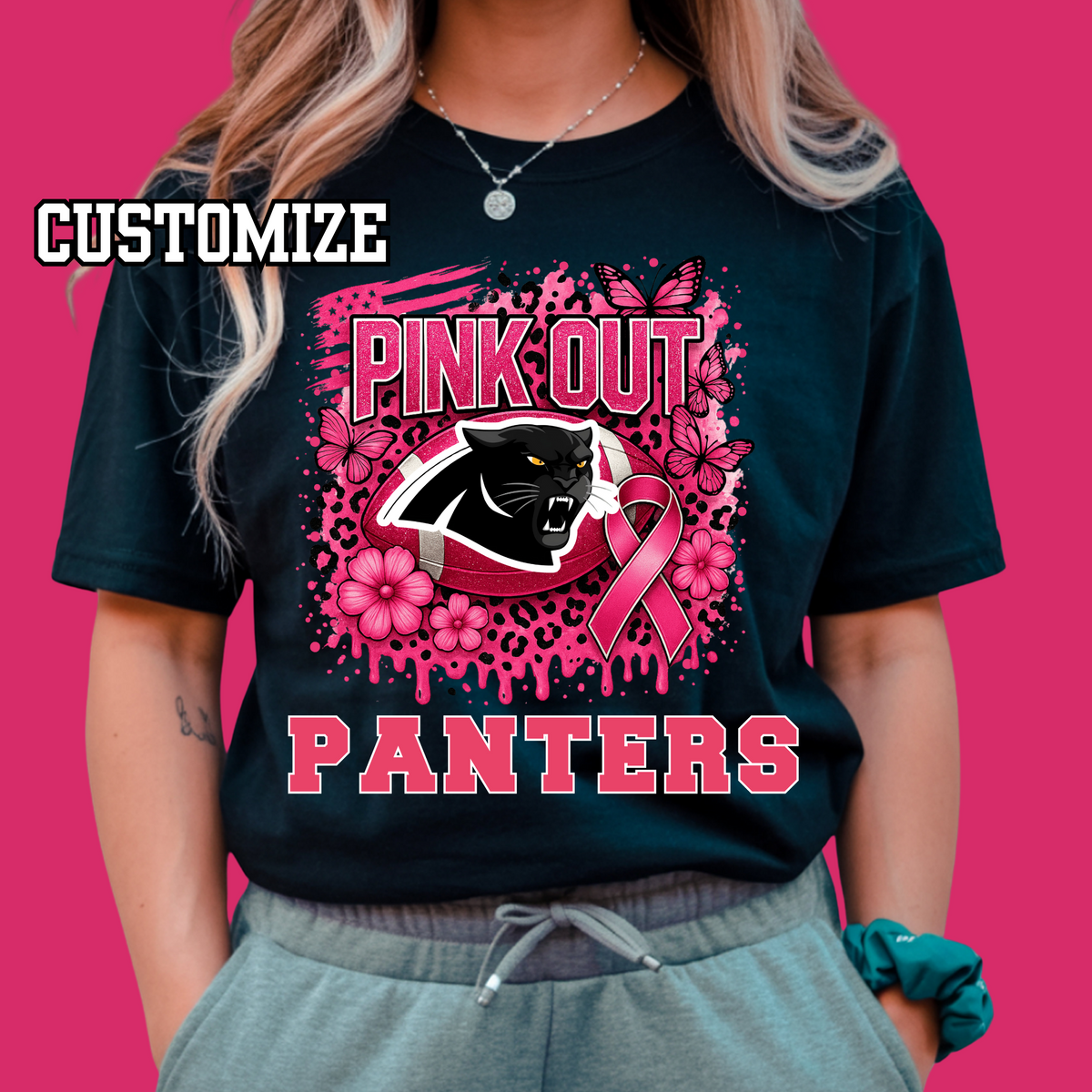 Black t-shirt with pink panther design and text on a pink background