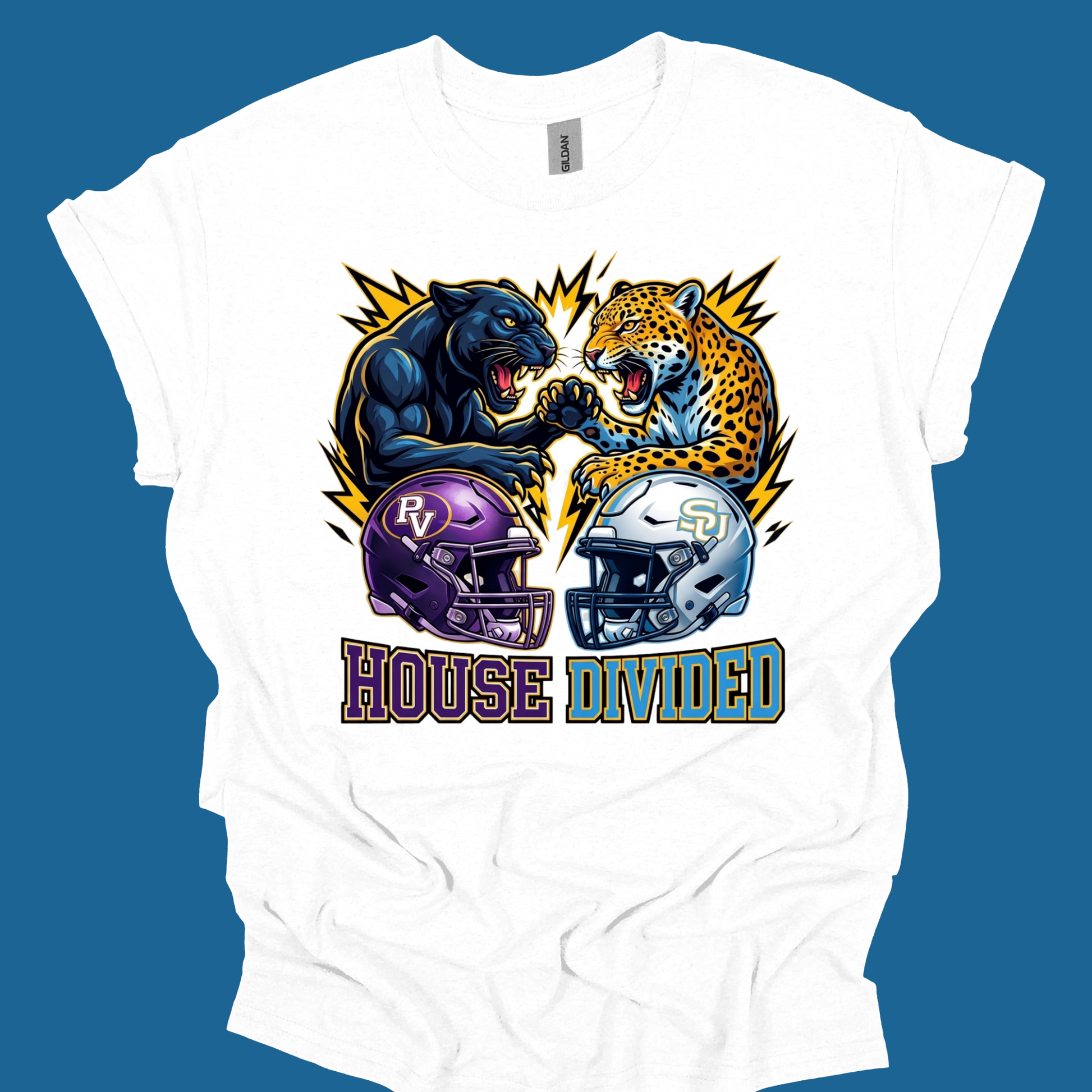 A white short-sleeve graphic t-shirt laid flat against a solid blue background. The graphic features a split design with a black panther on the left and a leopard on the right, facing each other, with purple and silver football helmets below them and the text 'HOUSE DIVIDED' underneath.