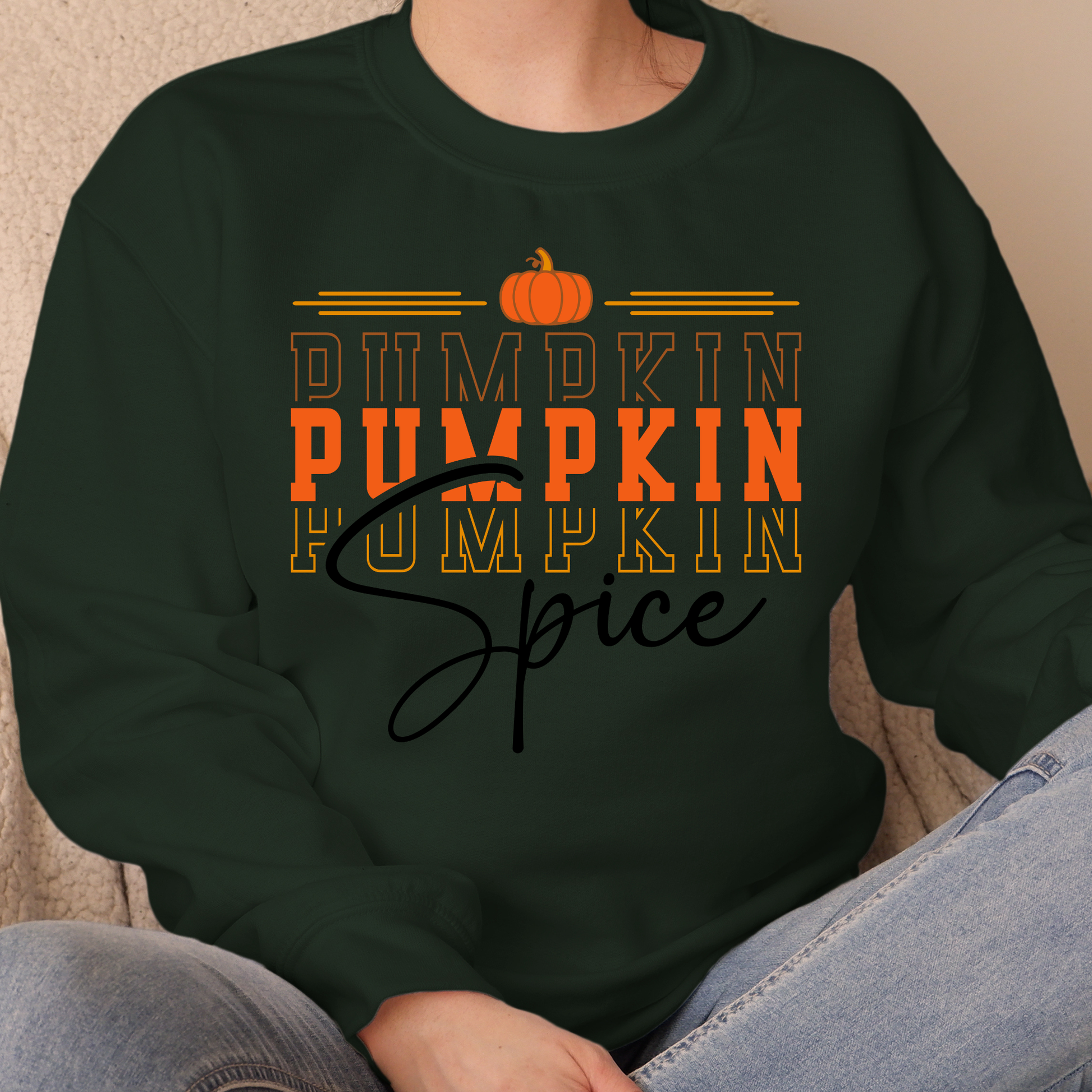 Person wearing a black sweatshirt with 'Pumpkin Pumpkin Spice' text and pumpkin graphics.