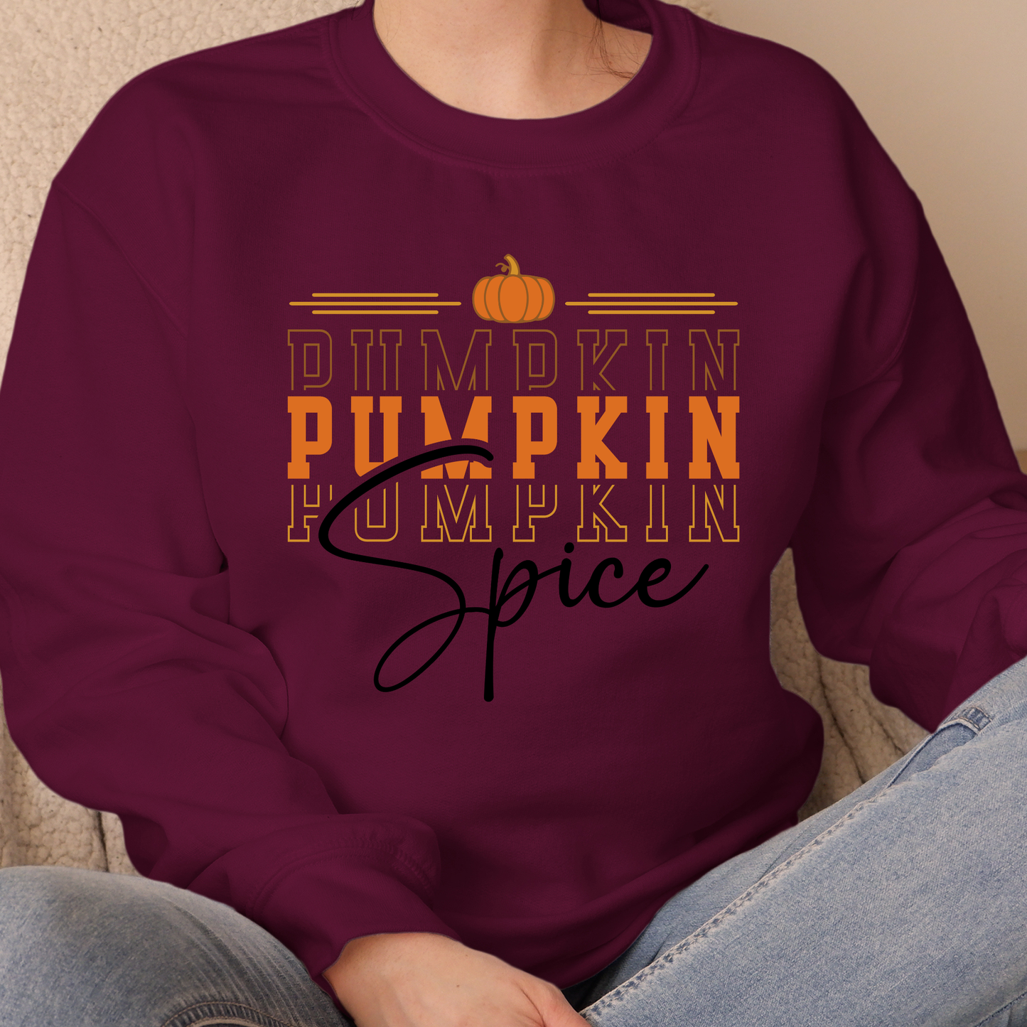 Maroon sweatshirt with 'Pumpkin Pumpkin Spice' text and pumpkin graphic.