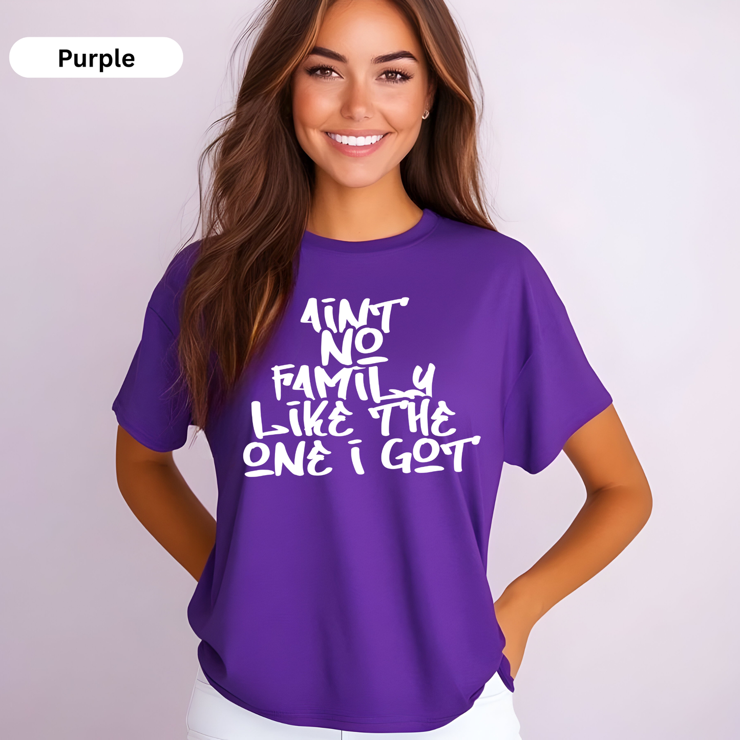 Woman wearing a purple t-shirt with white text on a plain background