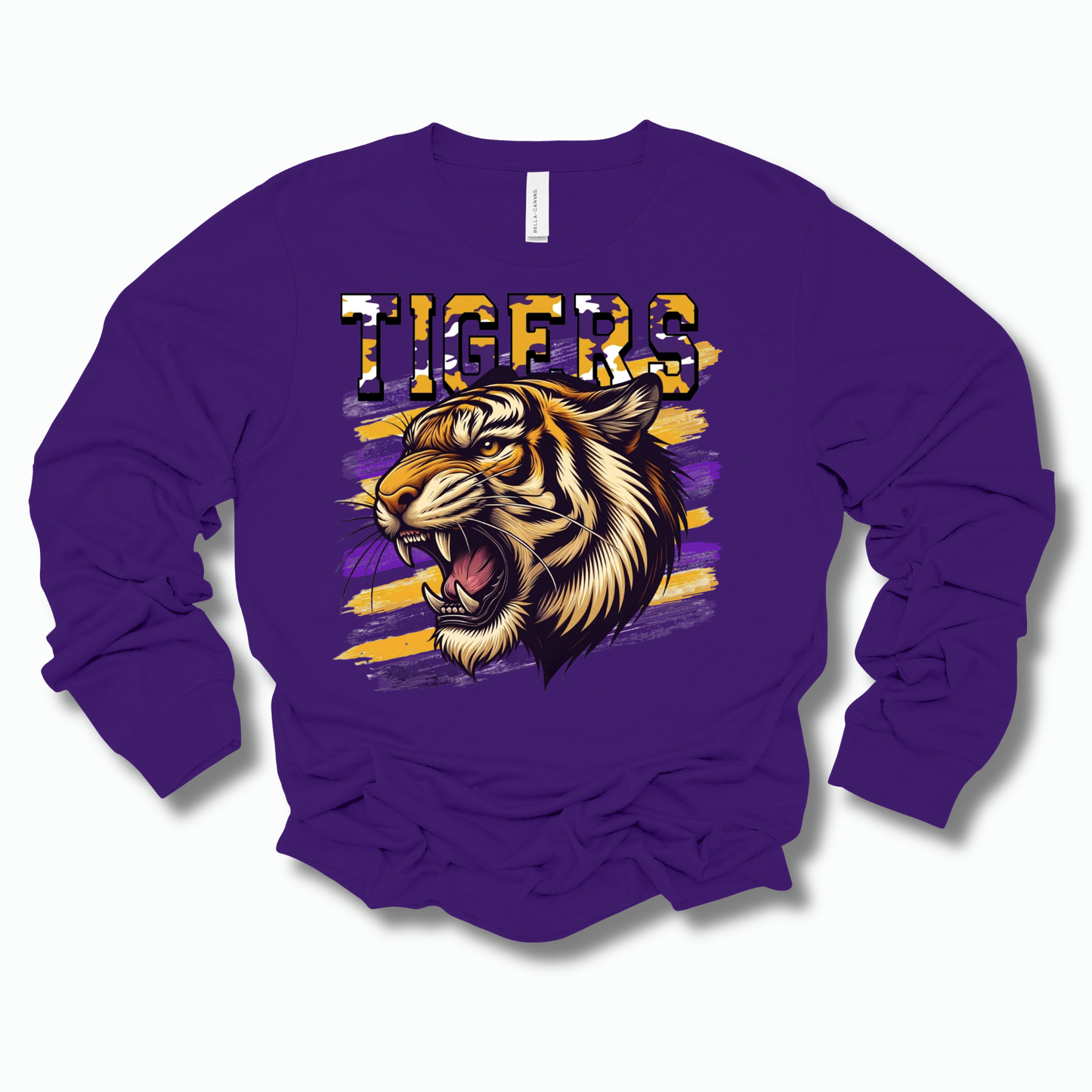 A purple long-sleeve crewneck sweatshirt featuring a graphic of a roaring tiger head and the word 'TIGERS' in a distressed yellow and purple font, displayed on a clean white background.