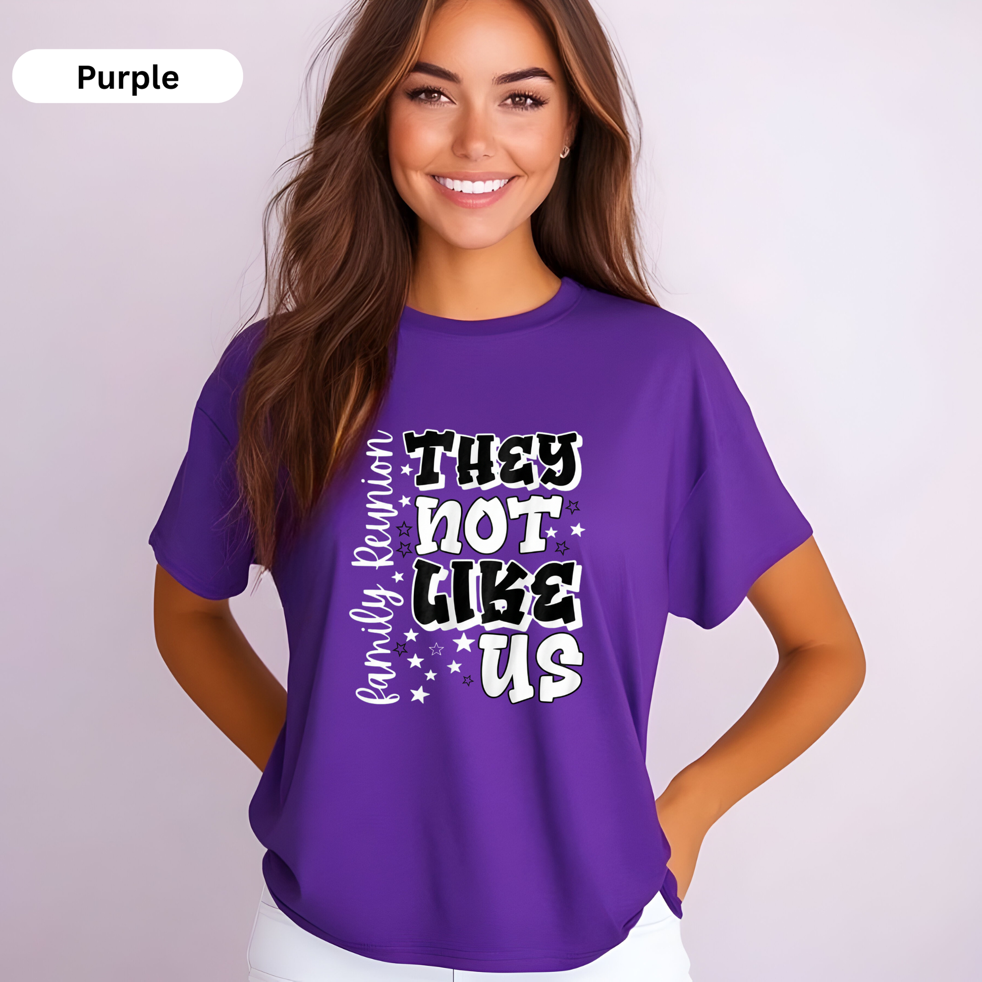 Woman wearing a purple t-shirt with text on a plain background