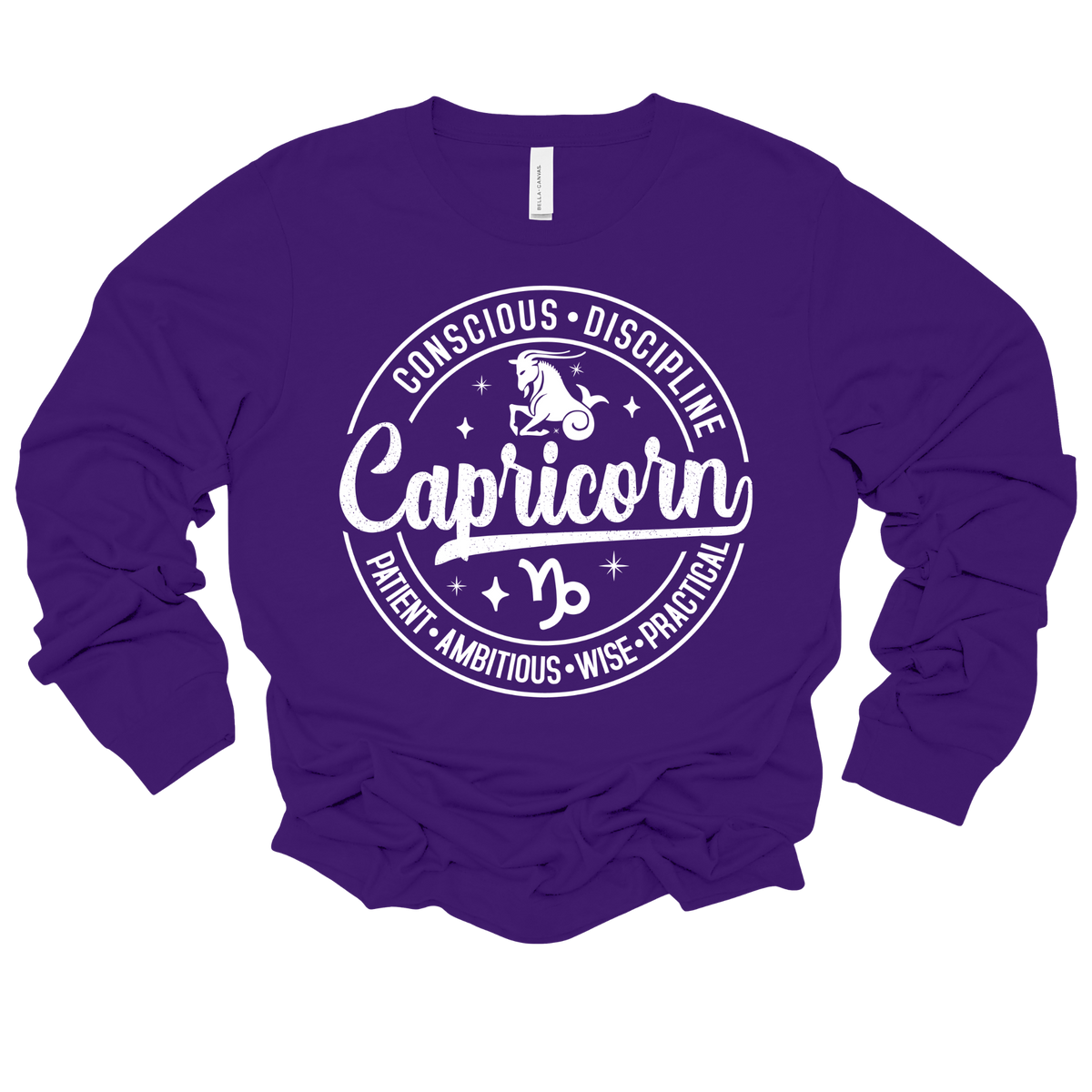 A purple long-sleeve t-shirt with a white circular graphic on the chest featuring the word 'Capricorn' and astrological symbols, displayed on a clean white background.