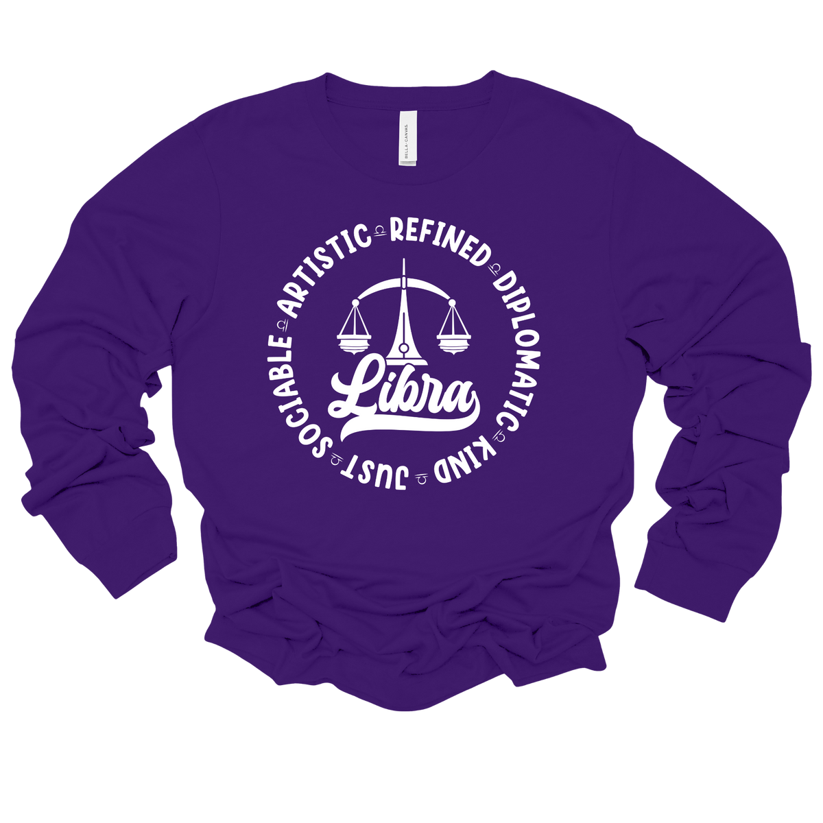 A purple long-sleeve crewneck sweatshirt with a white graphic print on the front featuring a Libra zodiac symbol and a circle of adjectives starting with the letter 'L'.