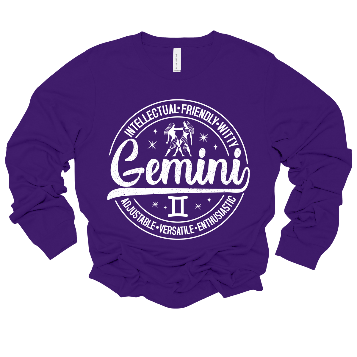 purple crewneck t-shirt laid flat, featuring a circular white Gemini zodiac graphic with the twins illustration, the word "Gemini," and trait keywords like intellectual, friendly, witty, enthusiastic, versatile, and adjustable.