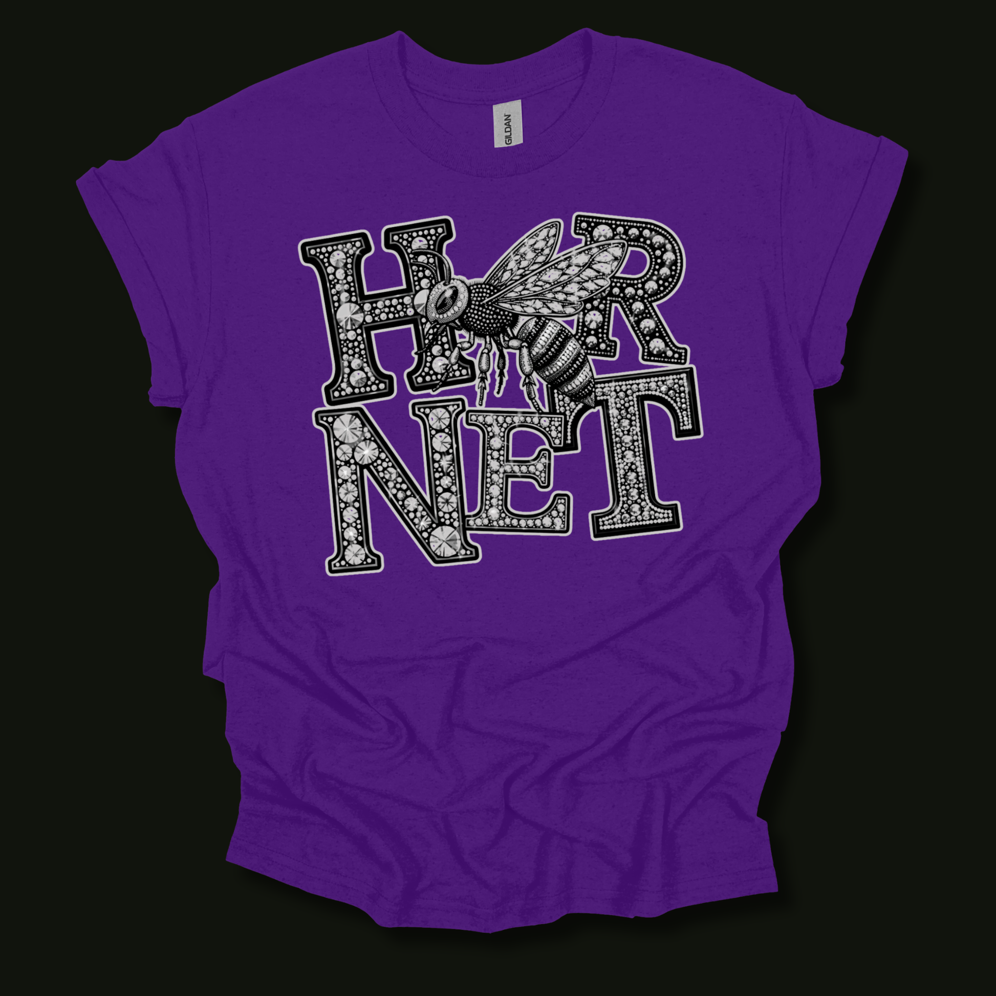 A purple short-sleeve t-shirt with a black and white graphic print reading 'HORNET' featuring a detailed bee design, laid flat against a black background.