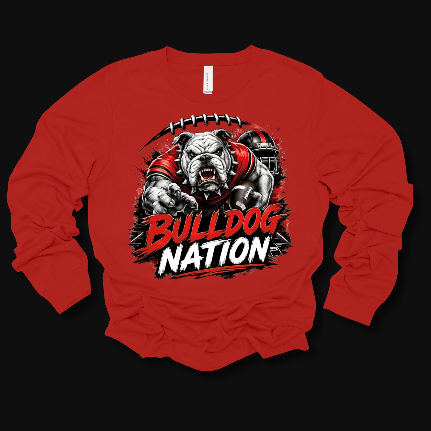 A red long-sleeve t-shirt with a large graphic print of a bulldog football player and the text 'BULLDOG NATION' on the front, displayed against a solid black background.
