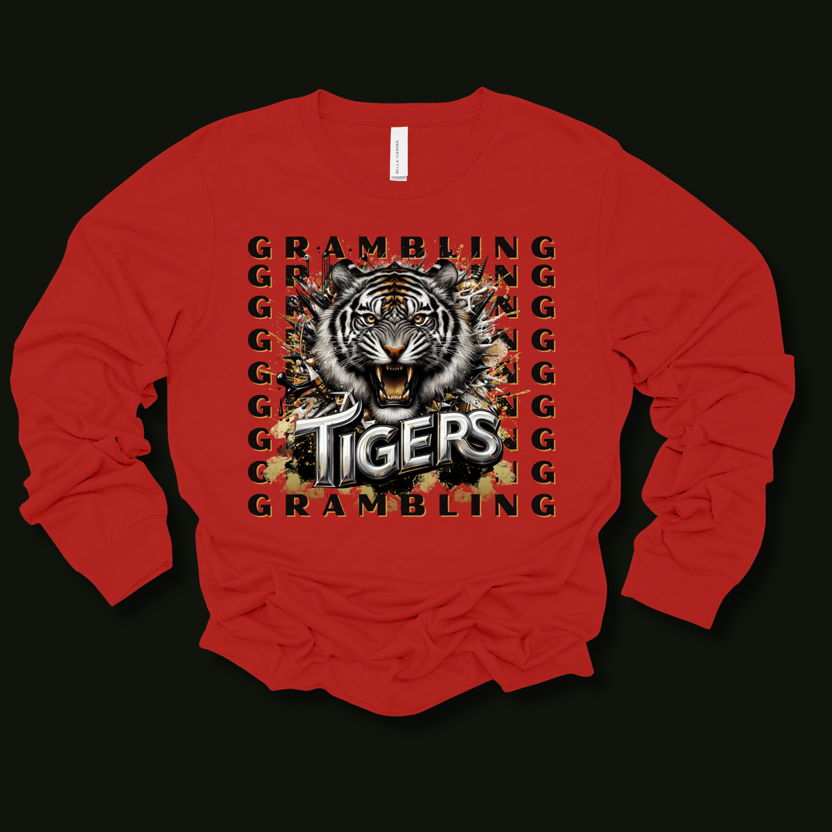 A red long-sleeve t-shirt with a graphic print of a tiger's head and the words 'GRAMBLING' and 'TIGERS' in a distressed, metallic style, displayed on a solid black background.