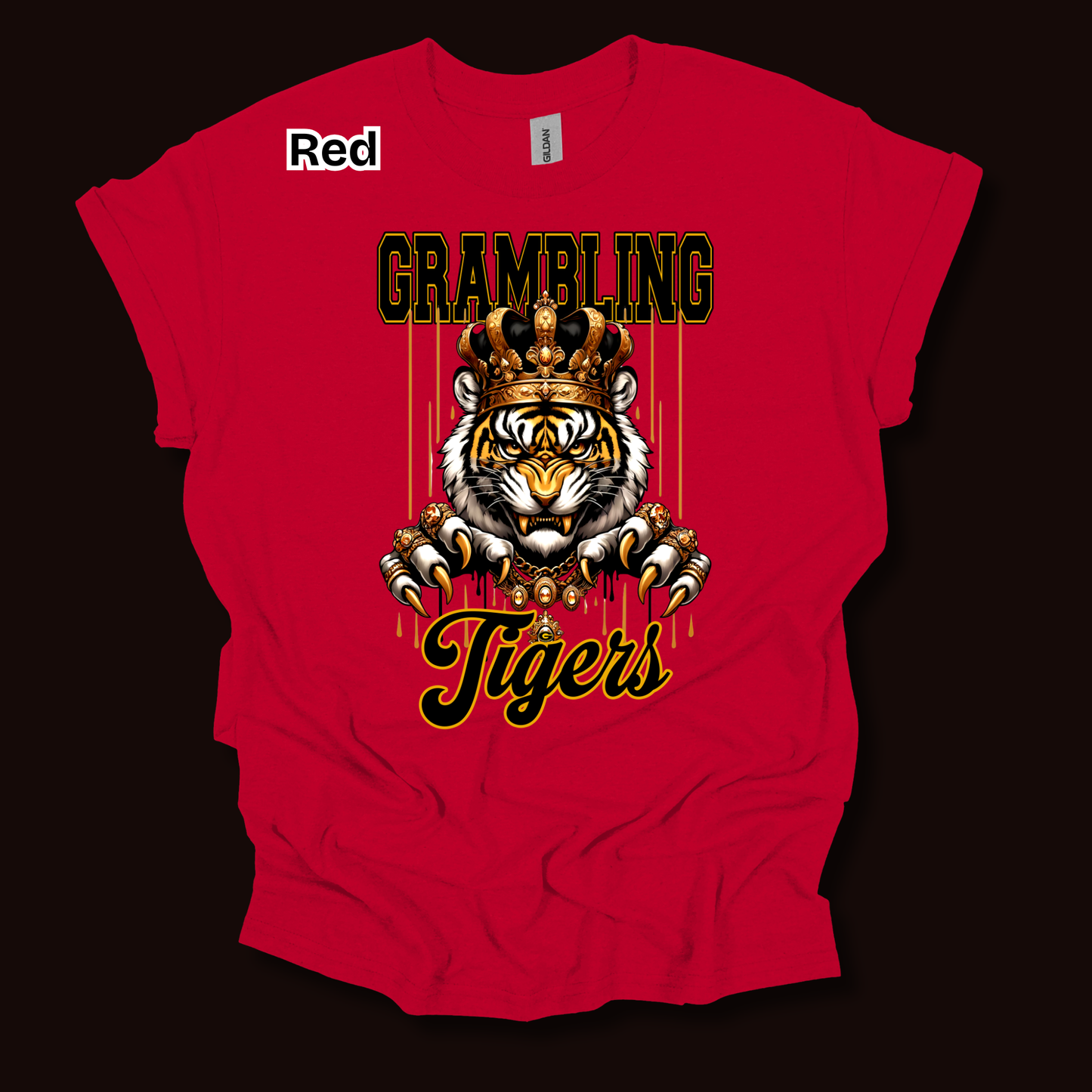A red short-sleeve t-shirt with a graphic print of a tiger wearing a crown, with the text 'GRAMBLING' above and 'Tigers' below, displayed on a dark background.