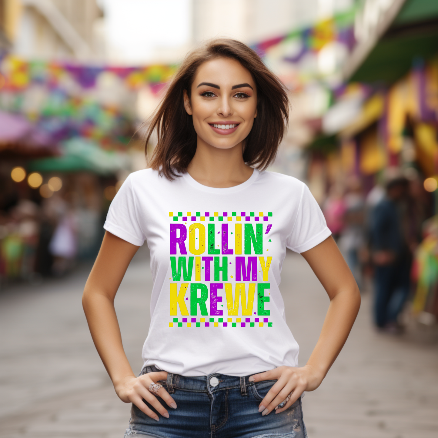 Woman wearing a white t-shirt with colorful text in an outdoor setting