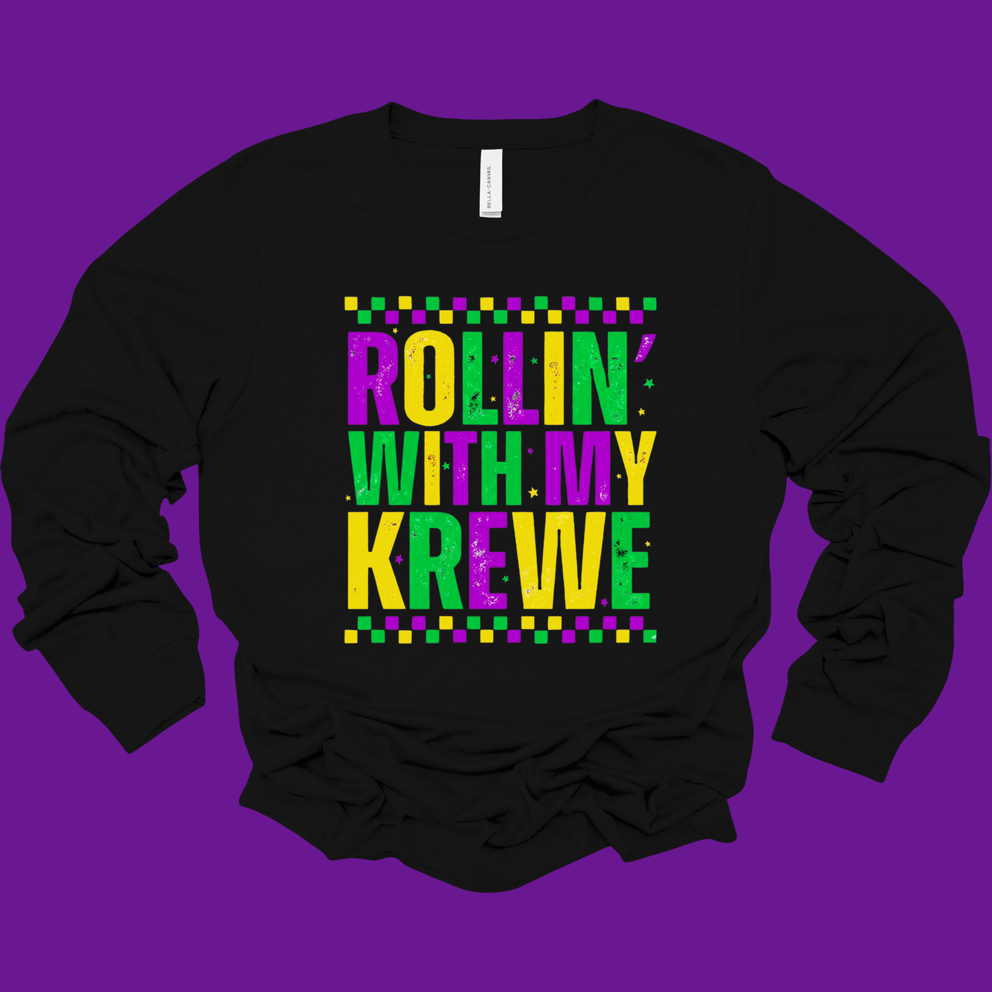 Black sweatshirt with colorful text 'Rollin' with my Krewe' on a purple background