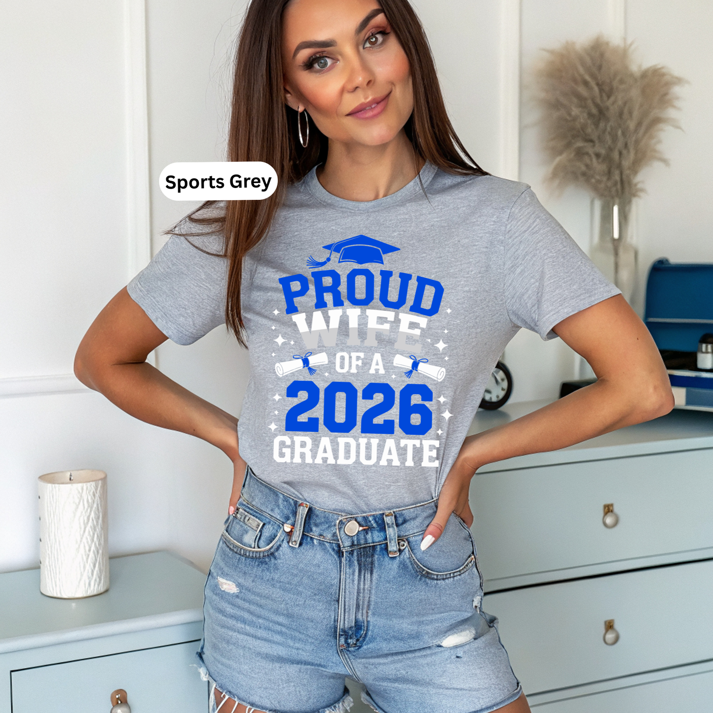 Woman wearing a 'Proud Parent of a 2026 Graduate' t-shirt in Sports Grey.