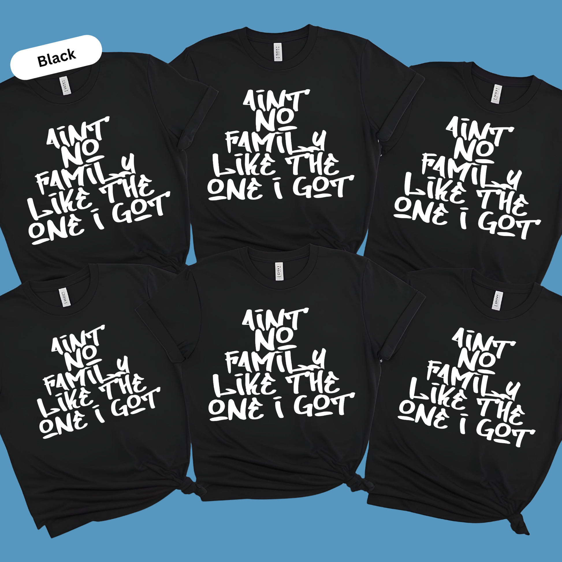 Black t-shirts with white text on a blue background