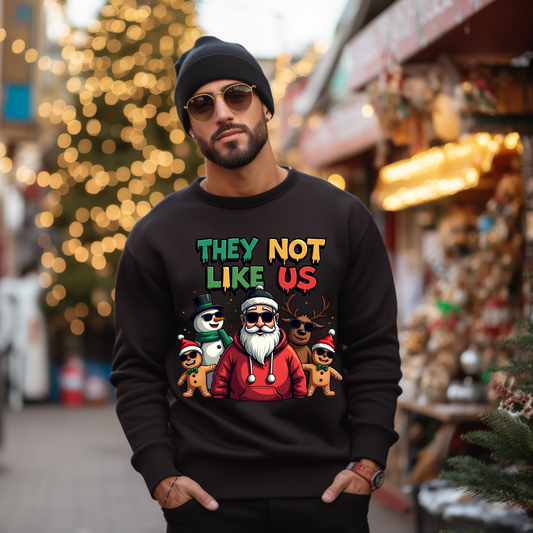 Person wearing a black sweatshirt with colorful graphic design in a festive outdoor setting.