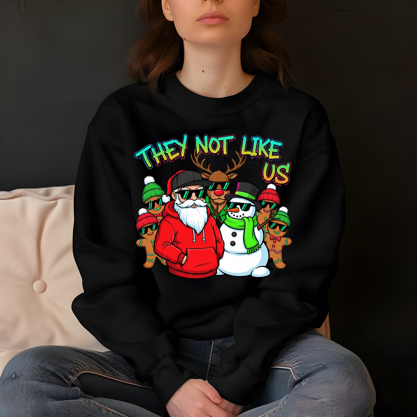 Person wearing a black sweatshirt with colorful graphic design featuring characters and text.