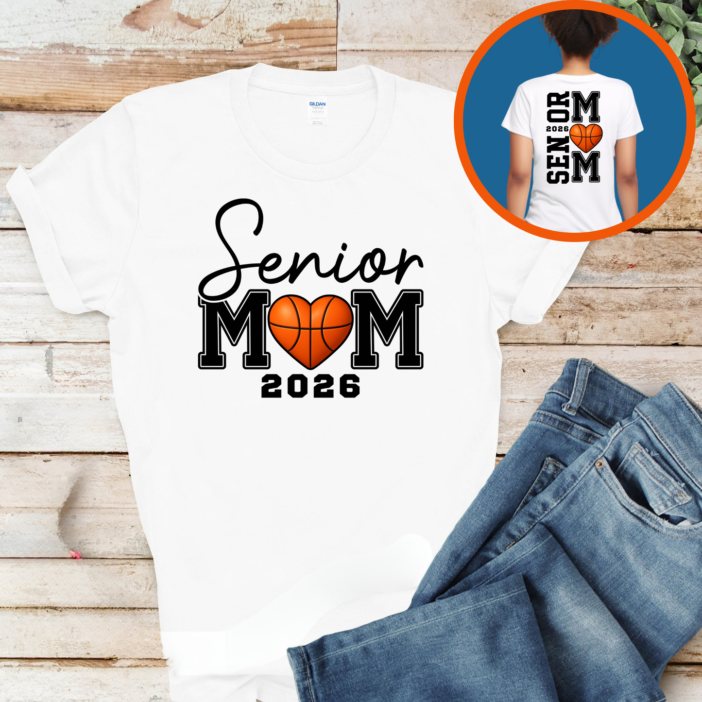 White t-shirt with 'Senior Mom 2026' design on a wooden surface with jeans.