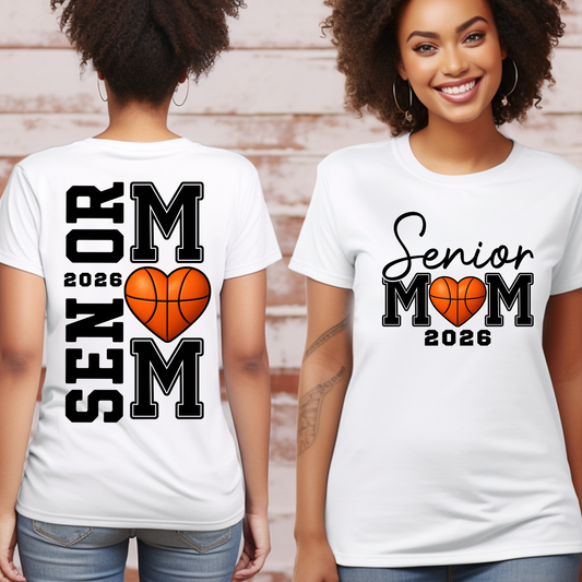 Two people wearing white t-shirts with 'Senior Mom 2026' and basketball design.
