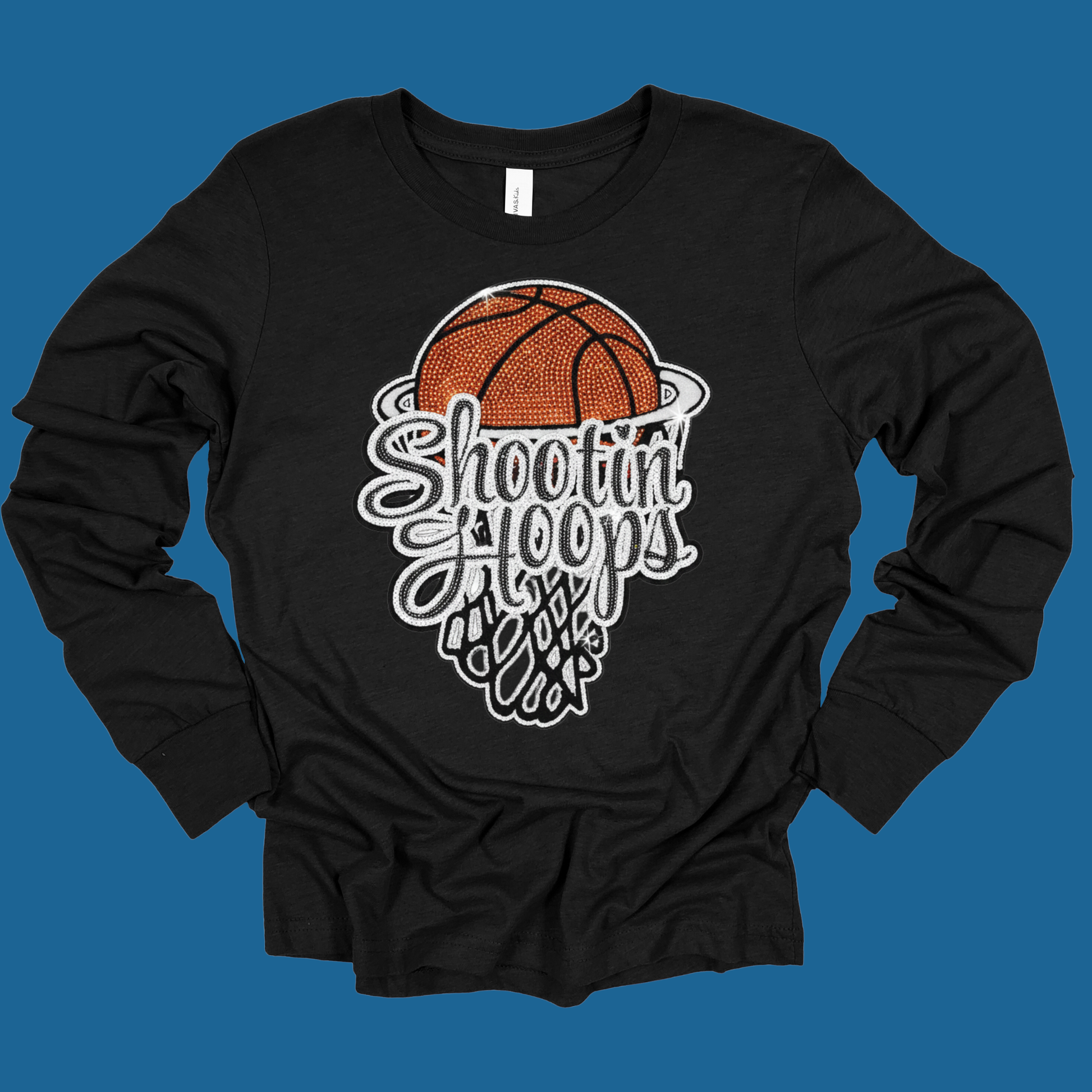 Black long-sleeve shirt with basketball graphic and 'Shootin Hoops' text on a blue background