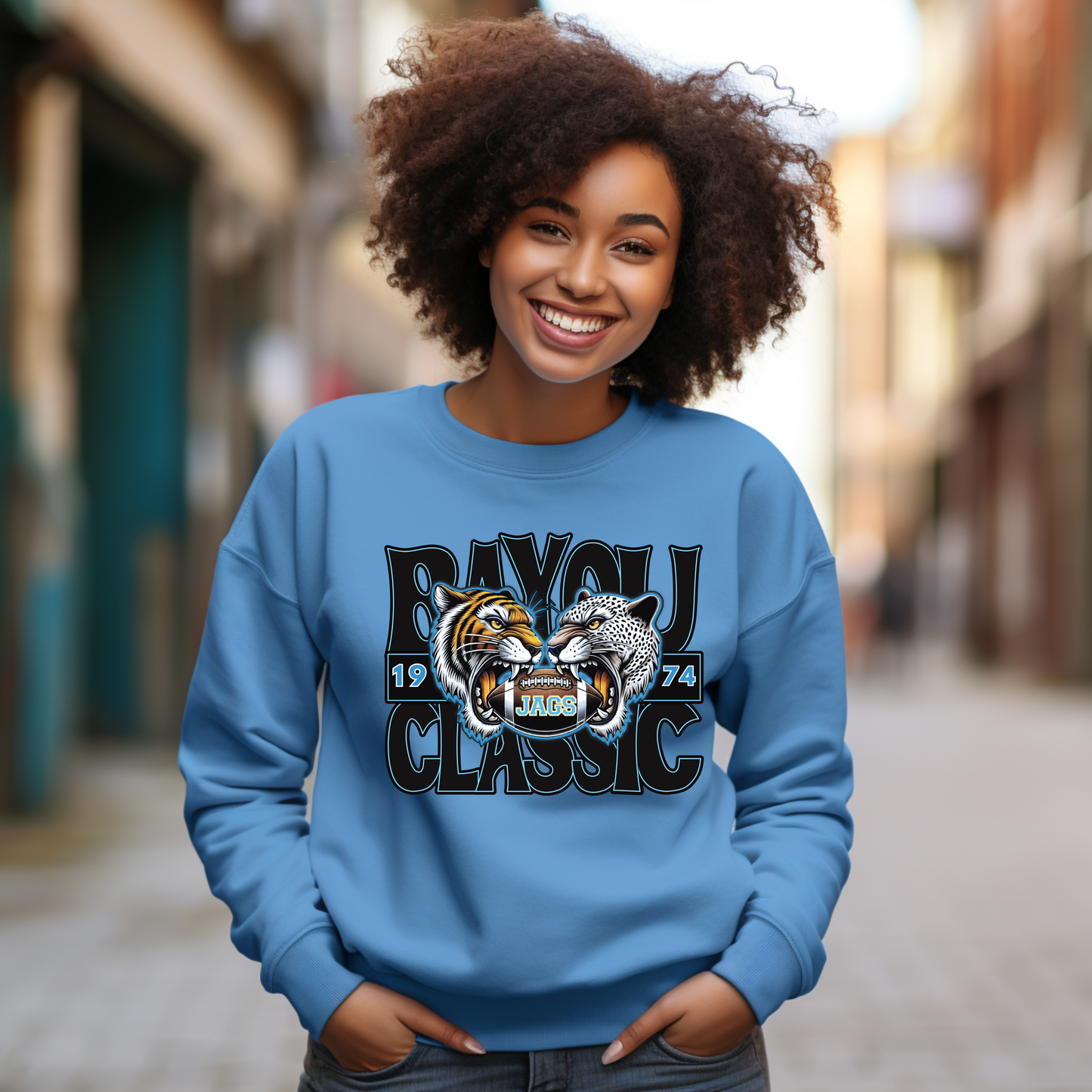 Person wearing a blue sweatshirt with a graphic design of two animals and text.