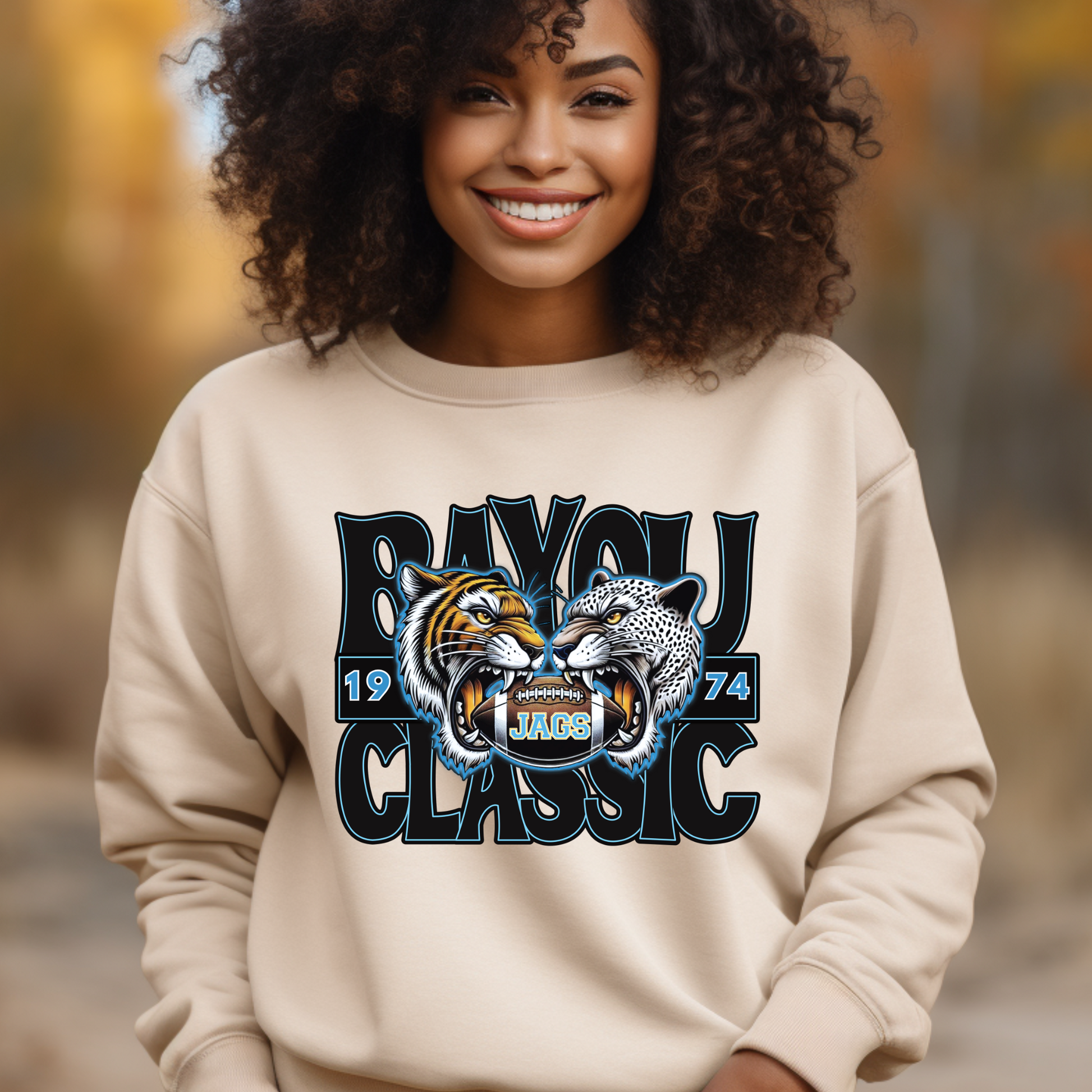 Person wearing a beige sweatshirt with a tiger and panther design and 'BAYOU CLASSIC' text.  Southern Jags Bayou Classic Apparel - Tailgating T-Shirt, Hoodie & Sweater