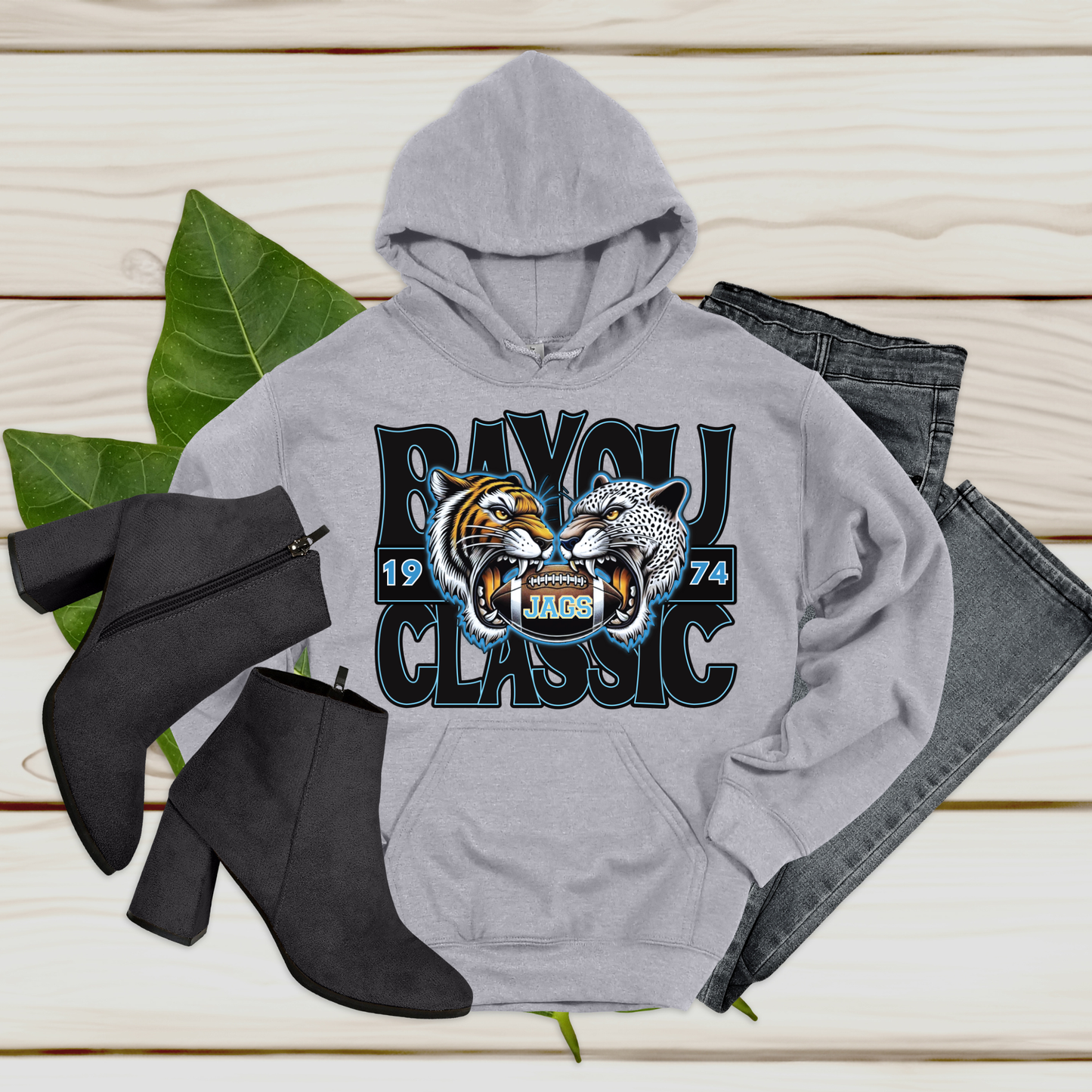 Gray hoodie with 'Baylor Classic' design, black boots, and jeans on a wooden surface.